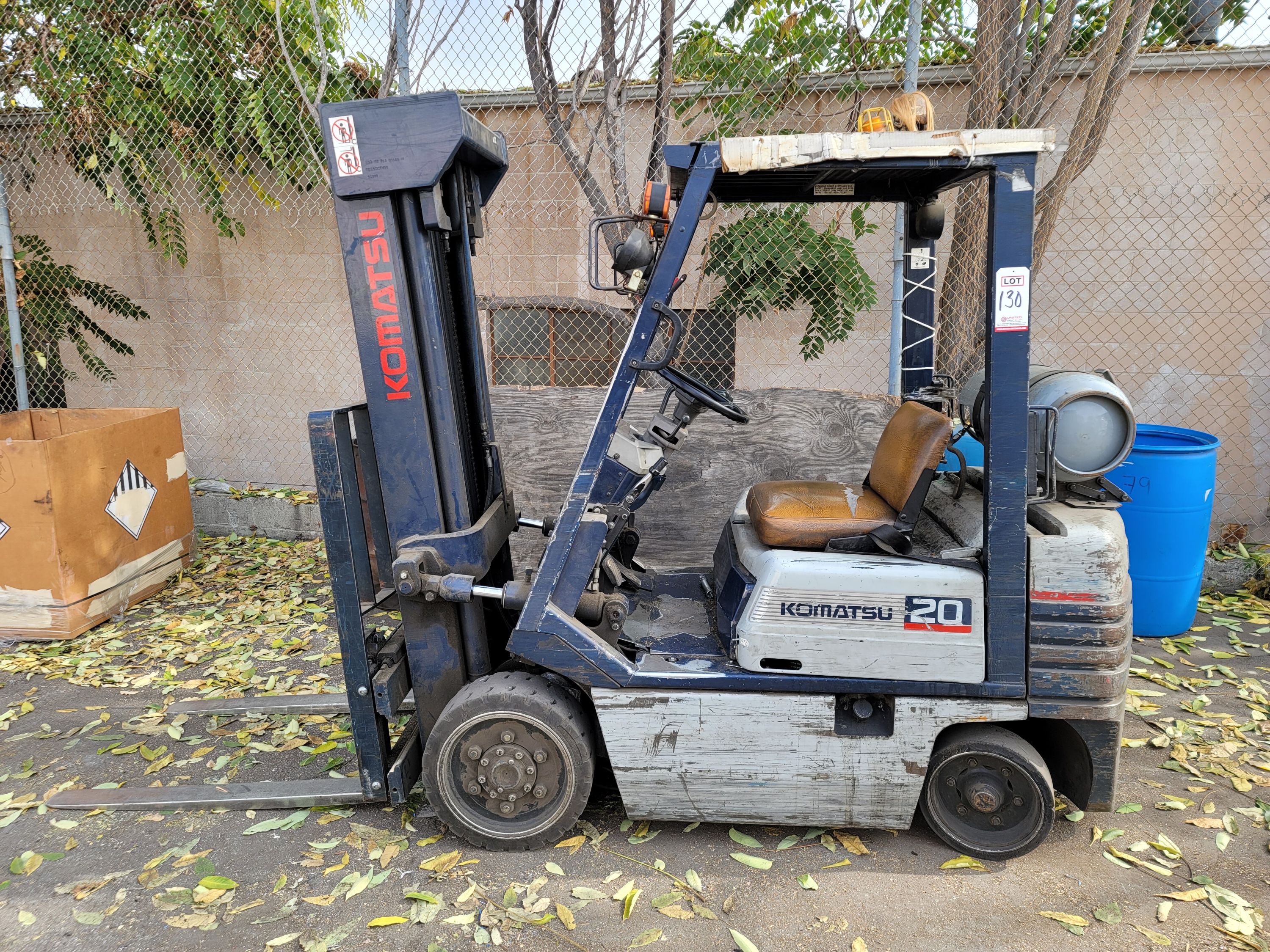 KOMATSU LPG FORKLIFT, MODEL FG 20ST11, 3,580 LBS CAPACITY, SIDE SHIFT, 6,927 HOURS, 3-STAGE MAST, 42" FORKS, SOLID TIRES, S/N 401500A, NOTE: LP TANK NOT INCLUDED-130