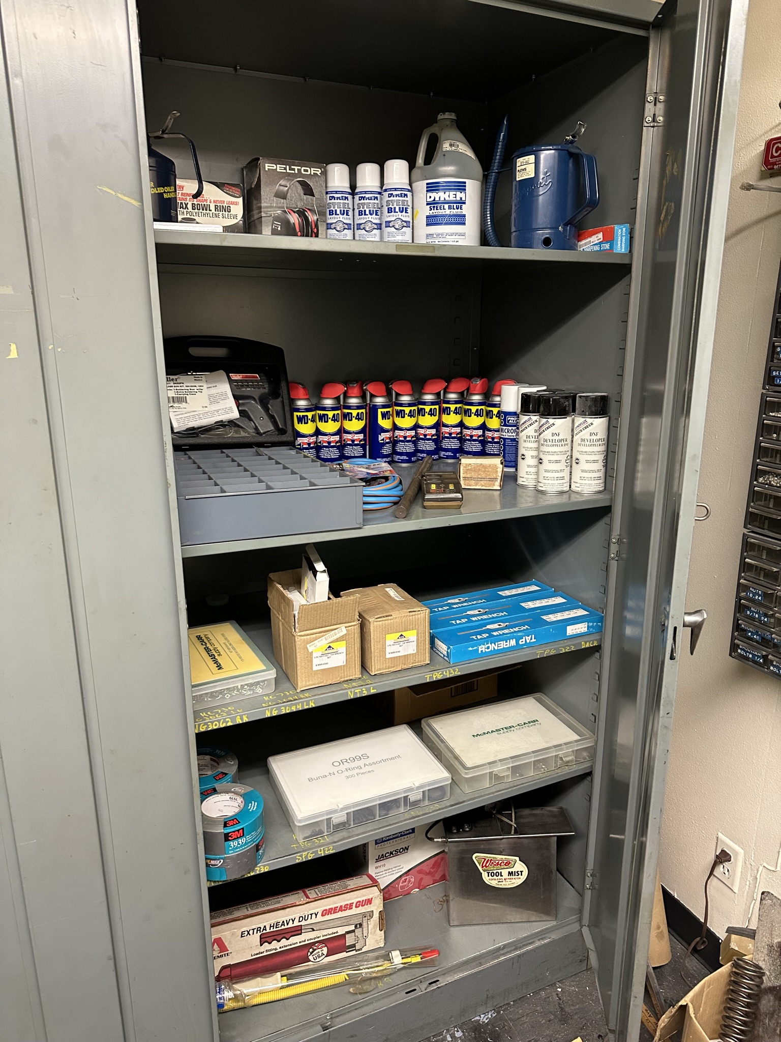 LOT - 2-DOOR STORAGE CABINET, W/ CONTENTS, TO INCLUDE: WELLER INDUSTRIAL 300/200 WATT SOLDER GUN KIT, WESCO TOOL MIST COOLANT GENERATOR, TAP WRENCHES, WD-40, STEEL BLUE LAYOUT FLUID, ETC.-498