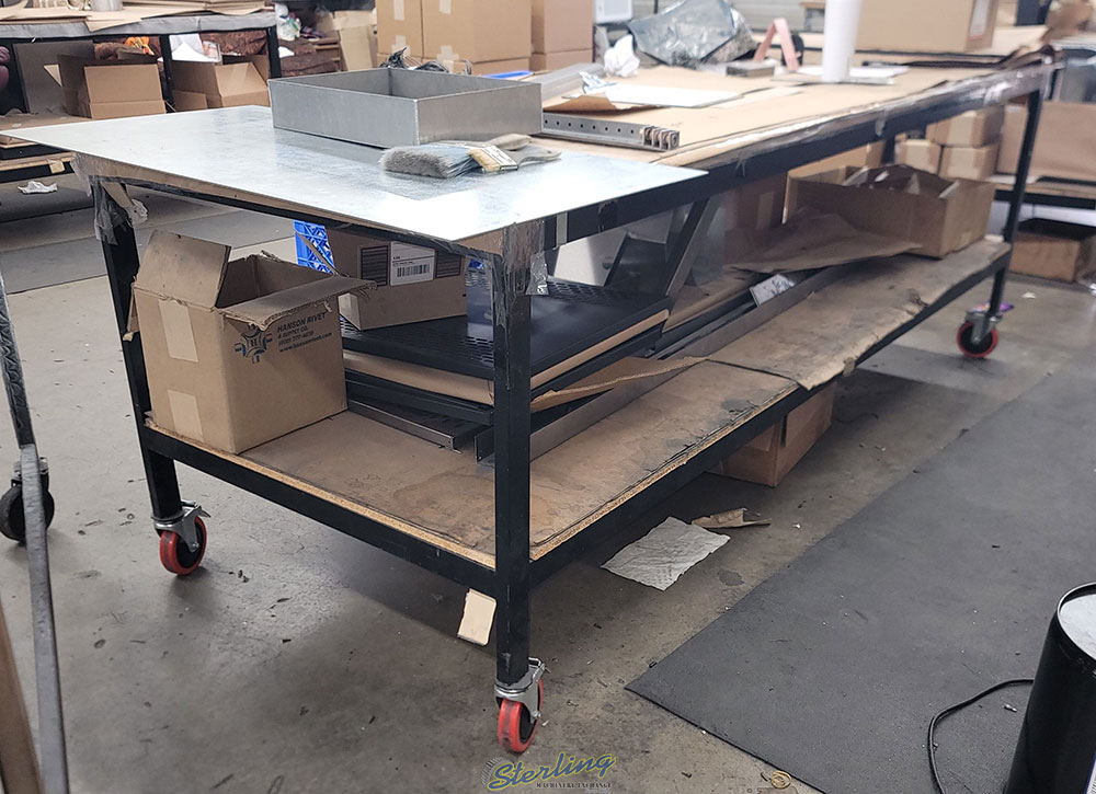 WORKBENCH ON CASTERS W  WOOD TOP 3 ft X 8 ft CONTENTS NOT INCLUDED-105