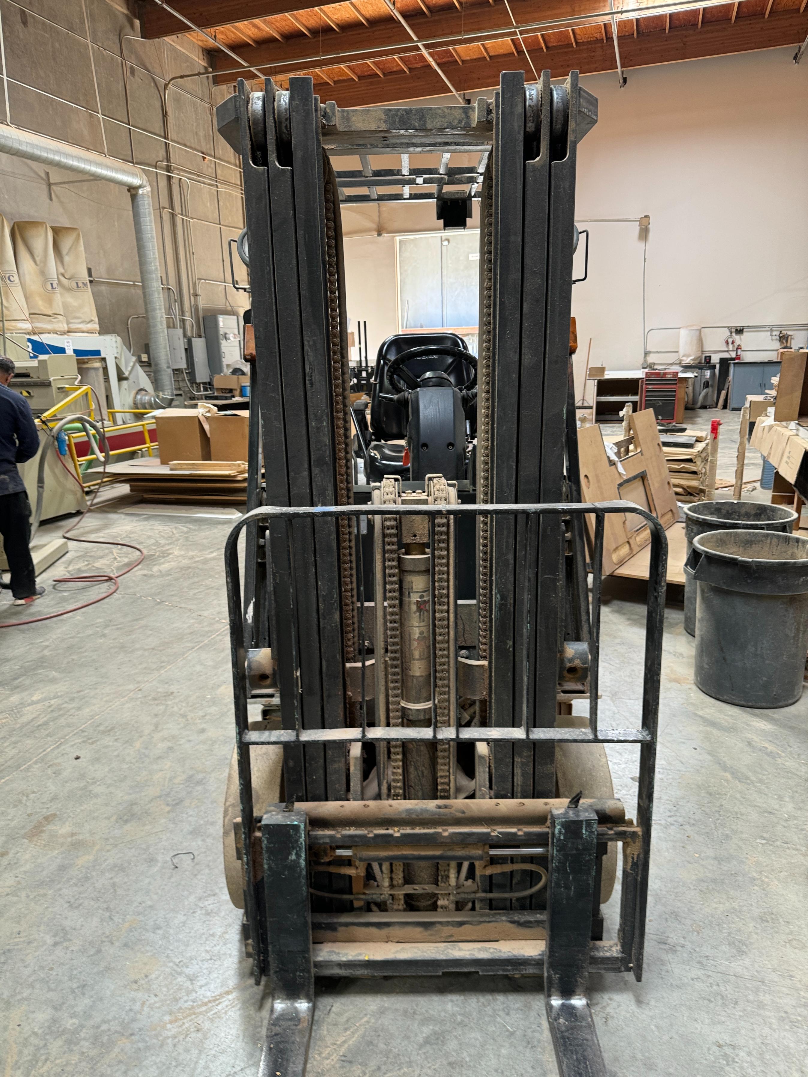 NISSAN ELECTRIC FORKLIFT, MODEL CP1B2L25S, 4,000 LB CAPACITY, 3-STAGE MAST, SIDE SHIFT, SOLID TIRES, 4' FORKS, LOAD LIGHTS, APPROX. 11,751 HOURS, S/N CP1B2-000219, W/ POWERHOUSE BATTERY CHARGER, (DELAYED PICKUP UNTIL FEBRUARY 20)-36