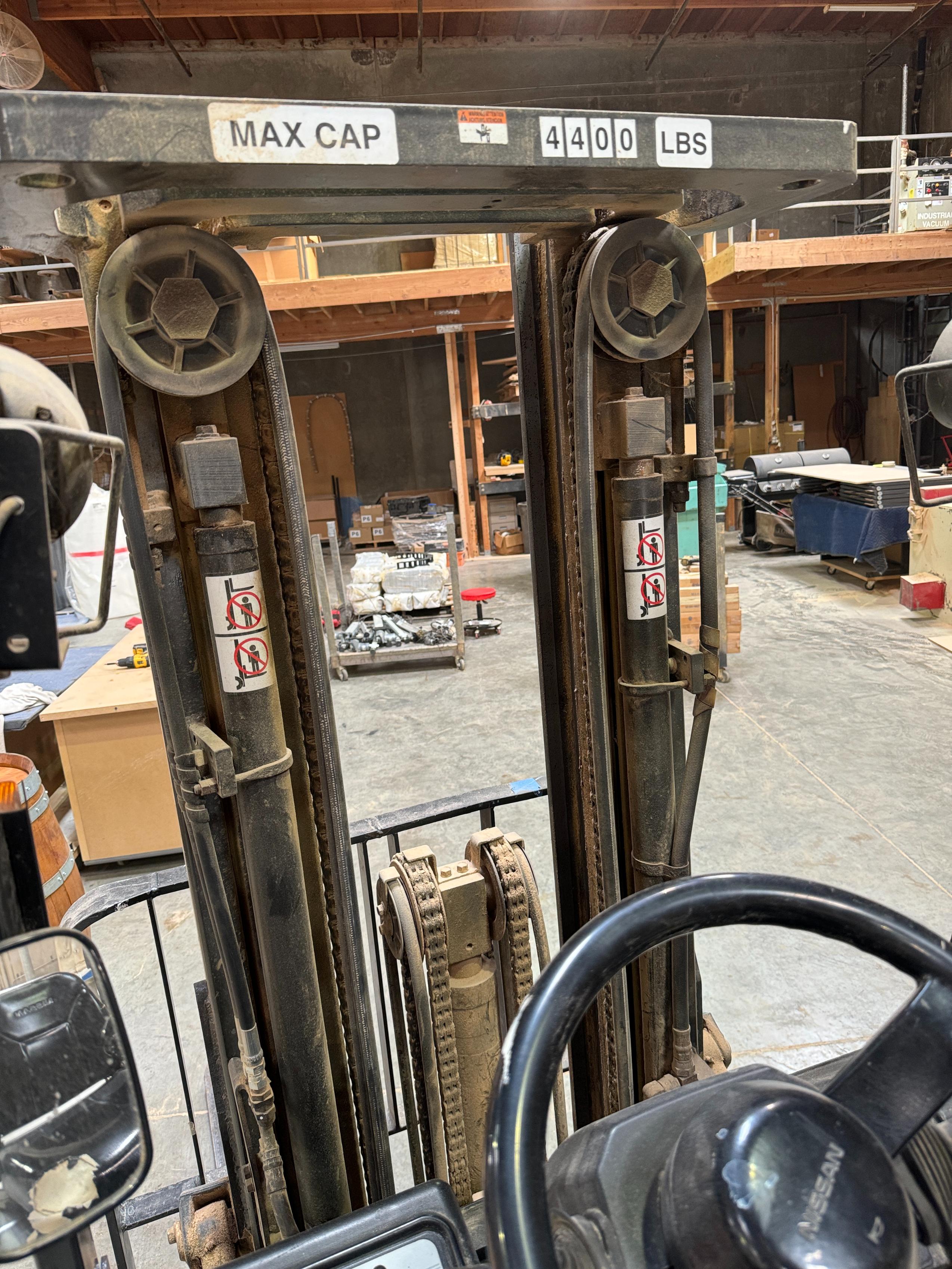 NISSAN ELECTRIC FORKLIFT, MODEL CP1B2L25S, 4,000 LB CAPACITY, 3-STAGE MAST, SIDE SHIFT, SOLID TIRES, 4' FORKS, LOAD LIGHTS, APPROX. 11,751 HOURS, S/N CP1B2-000219, W/ POWERHOUSE BATTERY CHARGER, (DELAYED PICKUP UNTIL FEBRUARY 20)-36