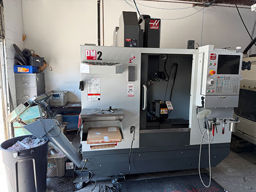 Haas-2022 HAAS DM-2 CNC VERTICAL DRILL/MILL MACHINING CENTER, MOLD MAKER, HAAS CNC CONTROL, TABLE: 34" X 15", XYZ TRAVELS: 28" X 16" X 15", CAT 40 TAPER, 15,000 RPM SPINDLE, SIDE MOUNT 18 ATC, 15 HP, THROUGH SPINDLE COOLANT, PROGRAMMABLE COOLANT NOZZLE, 32 GB EXPANDED MEMORY, WIRELESS INTUITIVE PROBING, TOOL AIR BLAST, CHIP CONVEYOR, 4TH AXIS READY, SUBPLATE, S/N 1197026-25