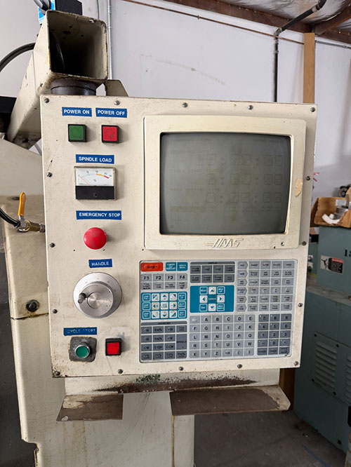 1992 HAAS VF-0 CNC VERTICAL MACHINING CENTER, TABLE: 26" X 14", XYZ TRAVELS: 20" X 16" X 20", CAT 40 TAPER, 7,500 RPM SPINDLE, 20 ATC, 7.5 HP, S/N 1870-34A