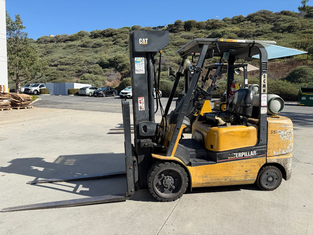 2004 CATERPILLAR LPG FORKLIFT, MODEL GC30K, 6,000 LB CAPACITY, 4-STAGE MAST, SIDE SHIFT, 5' FORKS, SOLID CUSHION TIRES, LOAD LIGHTS, REARVIEW MIRRORS, REAR SAFETY BEACON, CLEARCAP RAINCAP, APPROX. 8,077 HOURS, S/N AT83E00502, (DELAYED PICKUP UNTIL TUESDAY, AUGUST 18)-64