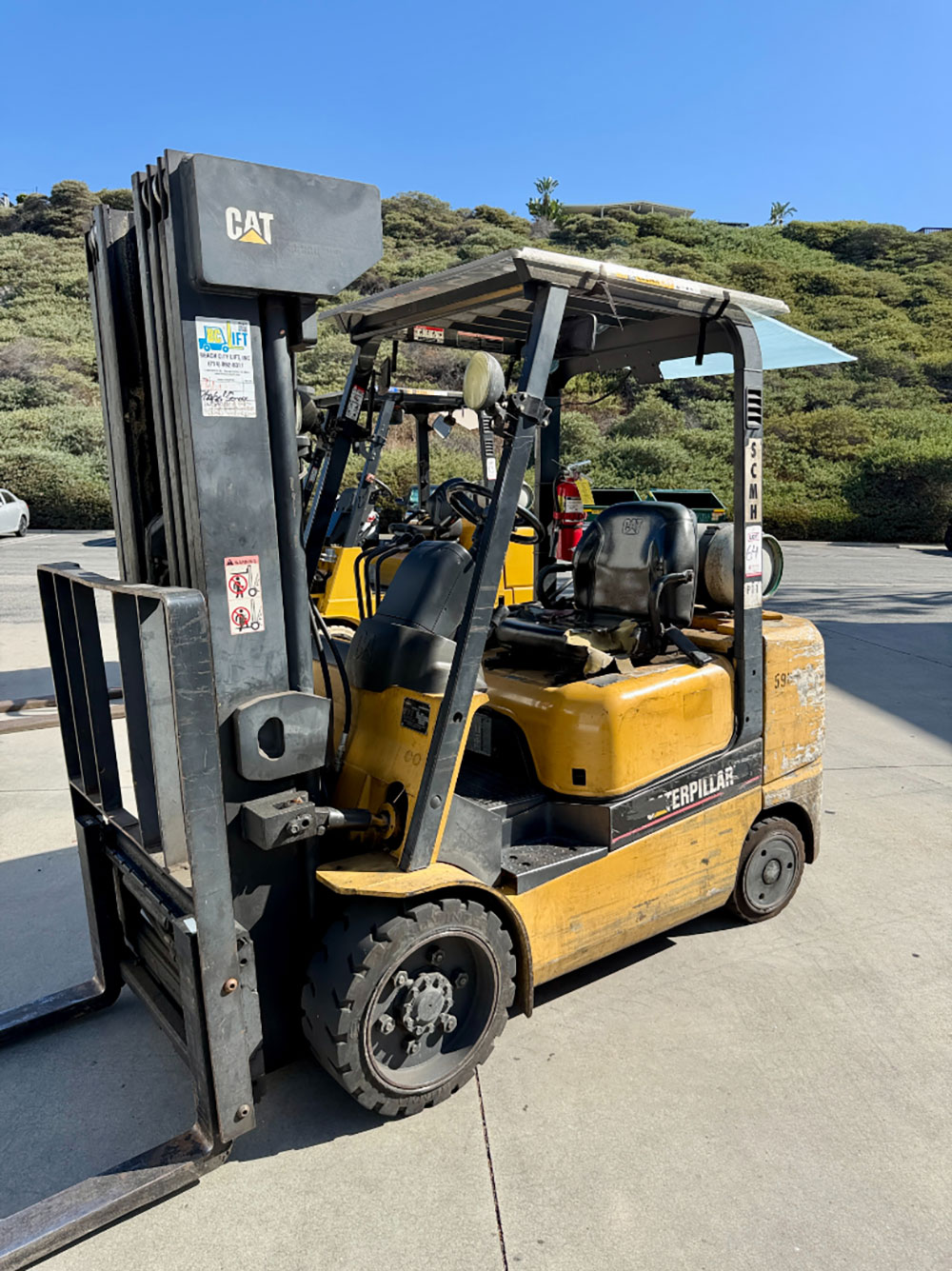 2004 CATERPILLAR LPG FORKLIFT, MODEL GC30K, 6,000 LB CAPACITY, 4-STAGE MAST, SIDE SHIFT, 5' FORKS, SOLID CUSHION TIRES, LOAD LIGHTS, REARVIEW MIRRORS, REAR SAFETY BEACON, CLEARCAP RAINCAP, APPROX. 8,077 HOURS, S/N AT83E00502, (DELAYED PICKUP UNTIL TUESDAY, AUGUST 18)-64
