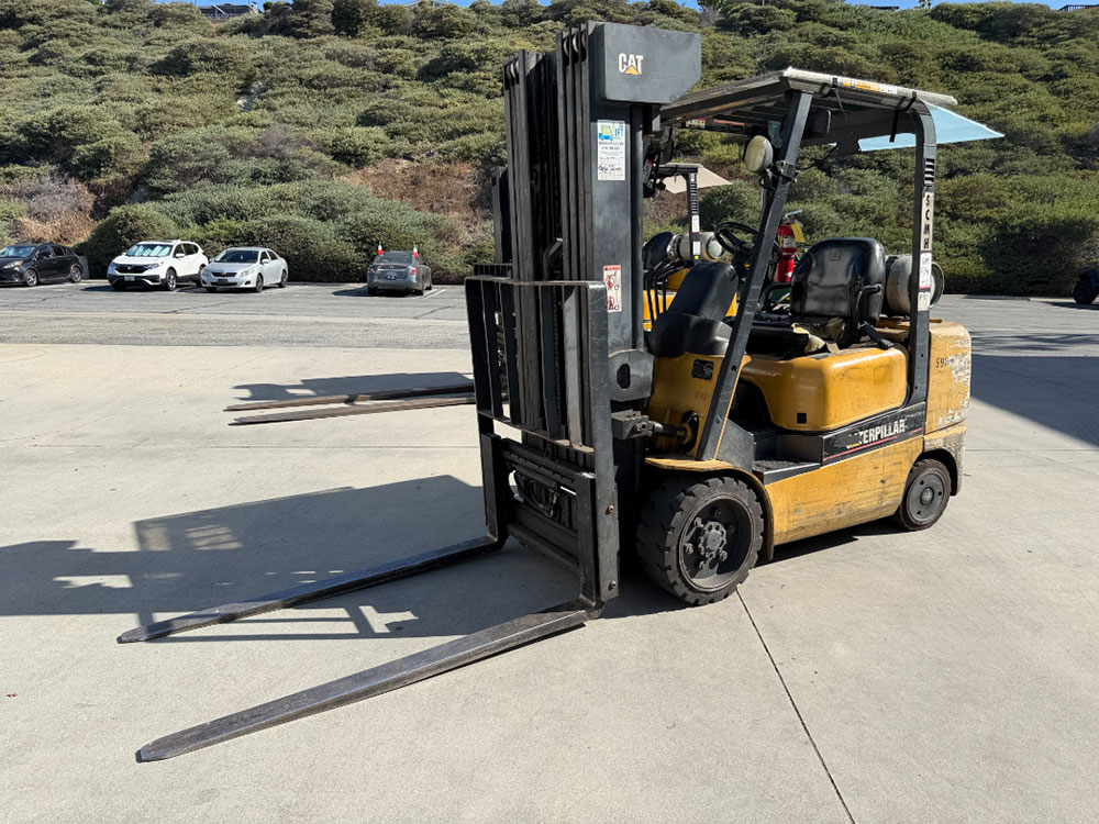 2004 CATERPILLAR LPG FORKLIFT, MODEL GC30K, 6,000 LB CAPACITY, 4-STAGE MAST, SIDE SHIFT, 5' FORKS, SOLID CUSHION TIRES, LOAD LIGHTS, REARVIEW MIRRORS, REAR SAFETY BEACON, CLEARCAP RAINCAP, APPROX. 8,077 HOURS, S/N AT83E00502, (DELAYED PICKUP UNTIL TUESDAY, AUGUST 18)-64