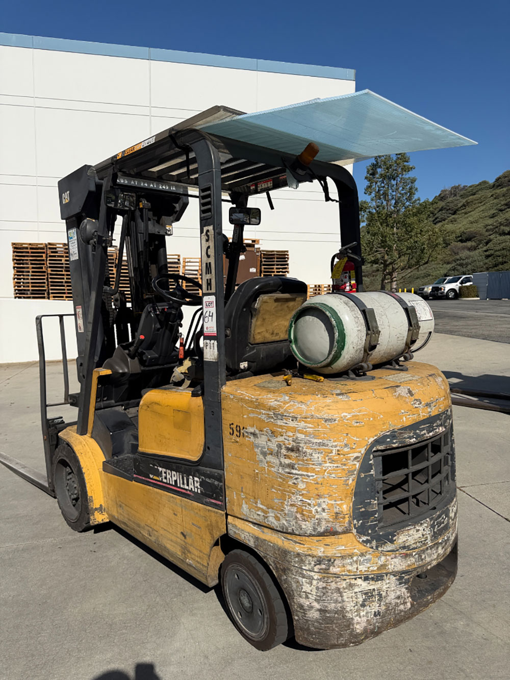 2004 CATERPILLAR LPG FORKLIFT, MODEL GC30K, 6,000 LB CAPACITY, 4-STAGE MAST, SIDE SHIFT, 5' FORKS, SOLID CUSHION TIRES, LOAD LIGHTS, REARVIEW MIRRORS, REAR SAFETY BEACON, CLEARCAP RAINCAP, APPROX. 8,077 HOURS, S/N AT83E00502, (DELAYED PICKUP UNTIL TUESDAY, AUGUST 18)-64