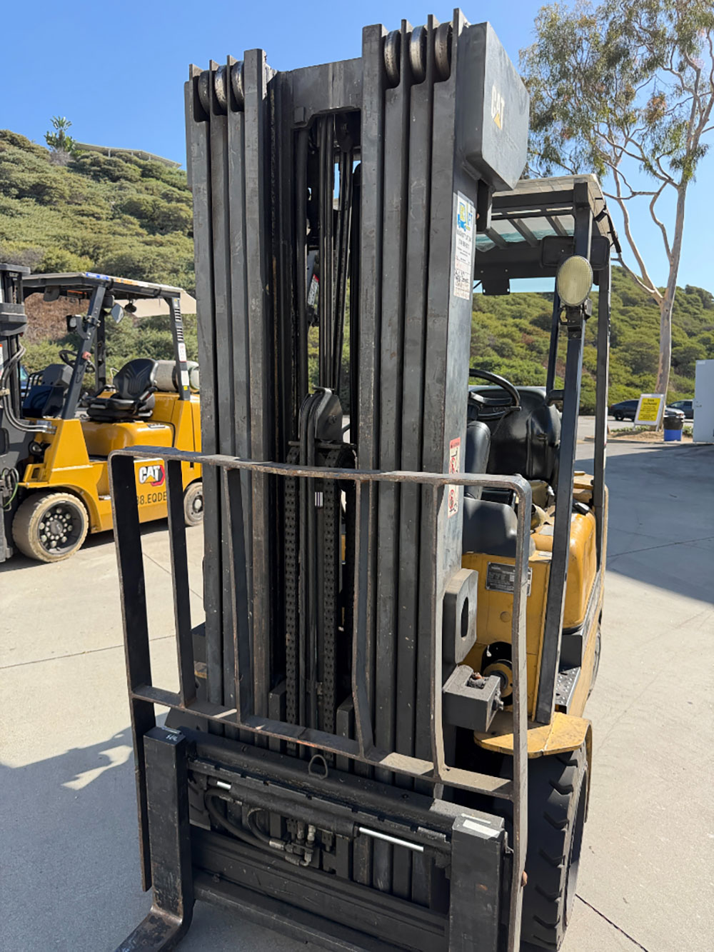 2004 CATERPILLAR LPG FORKLIFT, MODEL GC30K, 6,000 LB CAPACITY, 4-STAGE MAST, SIDE SHIFT, 5' FORKS, SOLID CUSHION TIRES, LOAD LIGHTS, REARVIEW MIRRORS, REAR SAFETY BEACON, CLEARCAP RAINCAP, APPROX. 8,077 HOURS, S/N AT83E00502, (DELAYED PICKUP UNTIL TUESDAY, AUGUST 18)-64