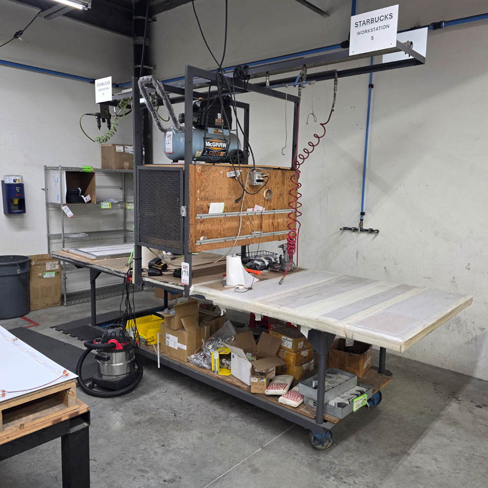 STEEL TABLE ON CASTERS W/ 12' X 4' WOOD TOP, 37" TOP HT, CENTER STORAGE, CONTENTS NOT INCLUDED-198
