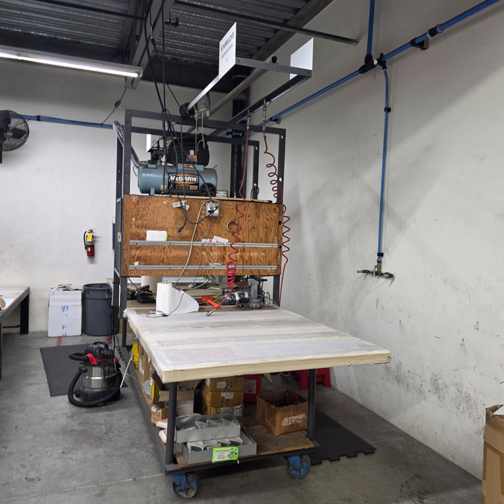 STEEL TABLE ON CASTERS W/ 12' X 4' WOOD TOP, 37" TOP HT, CENTER STORAGE, CONTENTS NOT INCLUDED-198