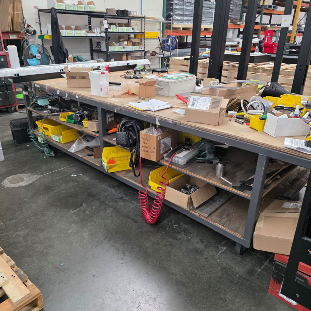 STEEL TABLE ON CASTERS W/ 14' X 5' WOOD TOP, 36" TOP HT, CONTENTS NOT INCLUDED-205