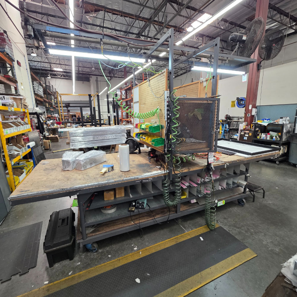STEEL TABLE ON CASTERS W/ 12' X 4' WOOD TOP, CENTER STORAGE AREA, CONTENTS NOT INCLUDED-207