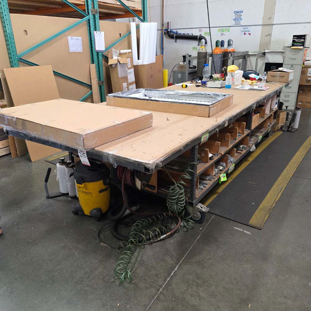 STEEL TABLE ON CASTERS W/ 14' X 5' WOOD TOP, CONTENTS NOT INCLUDED-215
