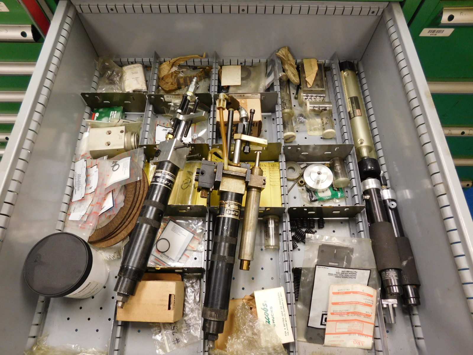 DOUBLE-SIDED ISLAND AREA: 5'X16'X8'! HIGHLIGHTS: GREEN OKUMA PARTS CABINET ENDCAP! (2) 7'X2'X8' SHELF UNITS FULL OF ASSORTED PARTS & PIECES: VARIOUS DIAMETERS OF SOFT COPPER PIPE ROLLS, BIG MACHINE DRIVE SCREWS, WELDING REGULATORS, 6 LISTA CABINETS, 28"X28"X60" & 2 STANLEY VIDMAR 30"X28"X66"CABINETS FULL OF ALL TYPES/SIZES OF BEARINGS, BAND HEATERS, VARIOUS SIZES OF LINK BELT CHAIN LENGTHS, SCHRADER BELLOWS PARTS, ELECTRONIC PARTS, CIRCUIT BOARDS, SELF FEED PARTS/TOOLS, RUBBER DRIVE BELTS, HOLE SAVERS,MOKON PARTS, SANDBLAST PARTS, LATHE PARTS, AIR LINE REGULATORS/LUBRICATORS, LIGHT BULBS, WELDING ACCESSORIES, ETC. - TOO MUCH TO LIST - COME SEE IT ALL, OR VIEW PHOTOS!-351
