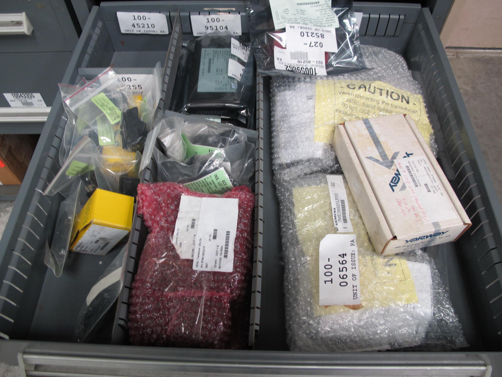 STANLEY VIDMAR CABINET, 5 DRAWER, TO INCLUDE: POPPET VALVES, PIPE REDUCERS, TRANSDUCERS, INPUT AND OUTPUT RELAYS. LOCATED AT W-44. LOADING AND HANDLING FEE $25-356