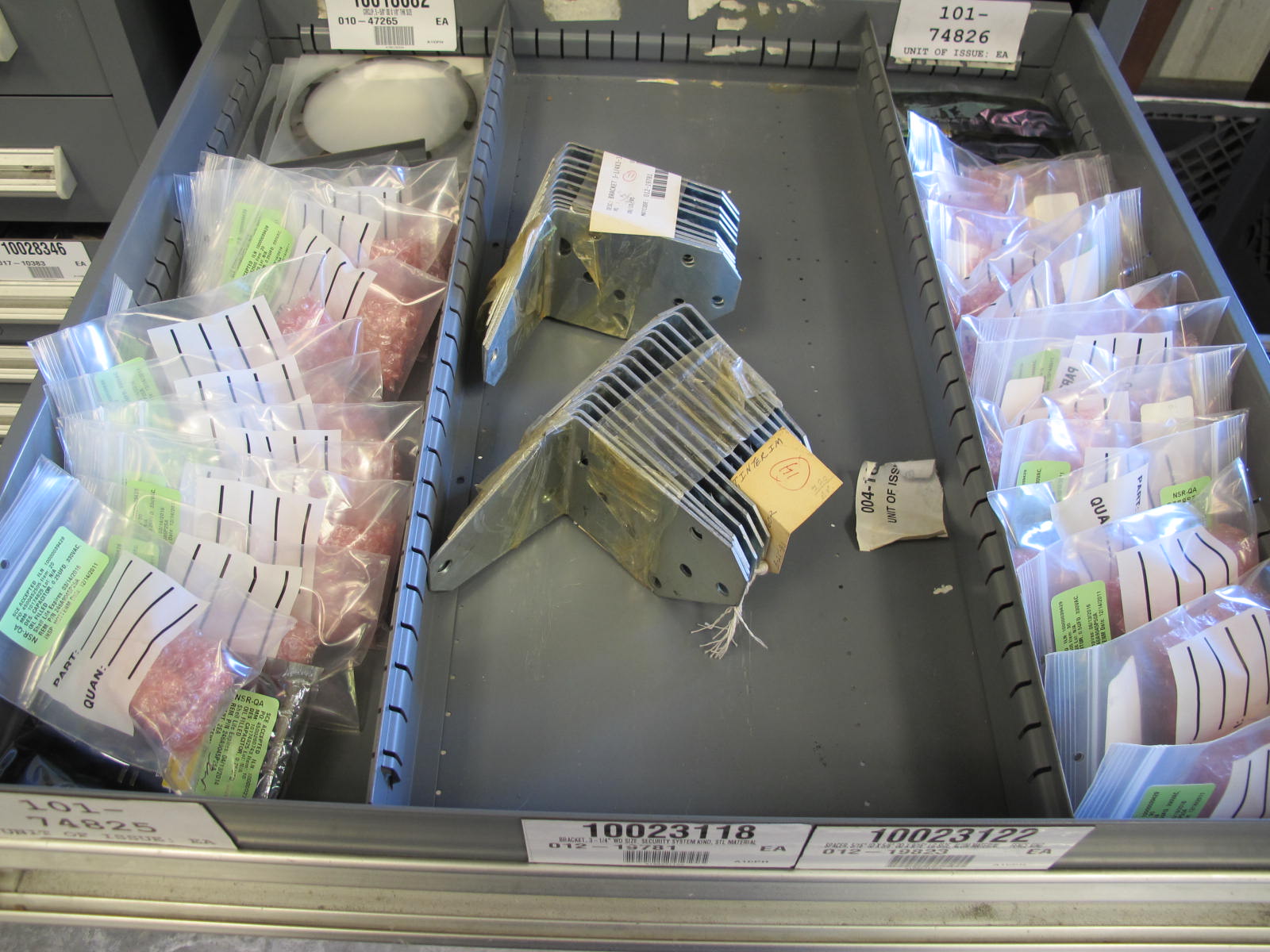 STANLEY VIDMAR CABINET, 11 DRAWER, TO INCLUDE: TUBE PLUGS, VALVES, SPRINGS, PINS, CIRCUIT BREAKERS, CAPACITORS. LOCATED AT W-44. LOADING AND HANDLING FEE $25-370