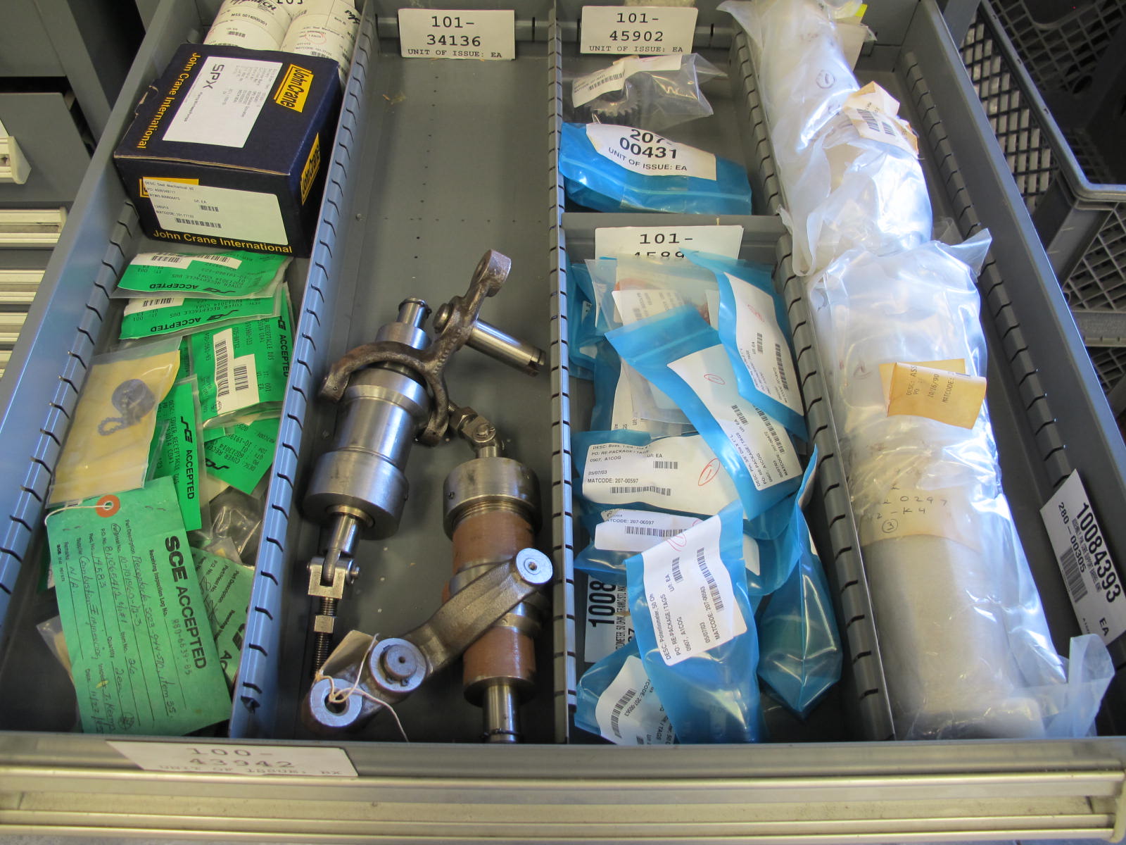 STANLEY VIDMAR CABINET, 11 DRAWER, TO INCLUDE: TUBE PLUGS, VALVES, SPRINGS, PINS, CIRCUIT BREAKERS, CAPACITORS. LOCATED AT W-44. LOADING AND HANDLING FEE $25-370