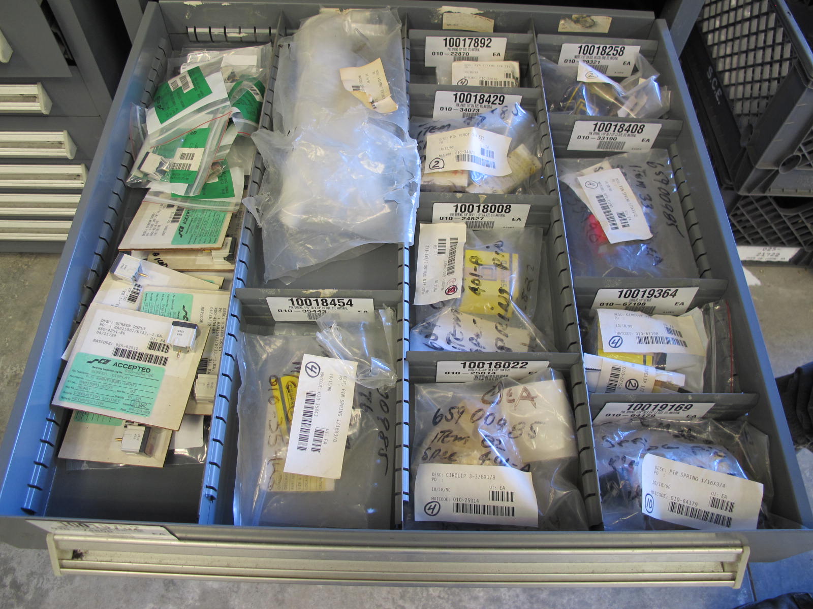 STANLEY VIDMAR CABINET, 11 DRAWER, TO INCLUDE: TUBE PLUGS, VALVES, SPRINGS, PINS, CIRCUIT BREAKERS, CAPACITORS. LOCATED AT W-44. LOADING AND HANDLING FEE $25-370