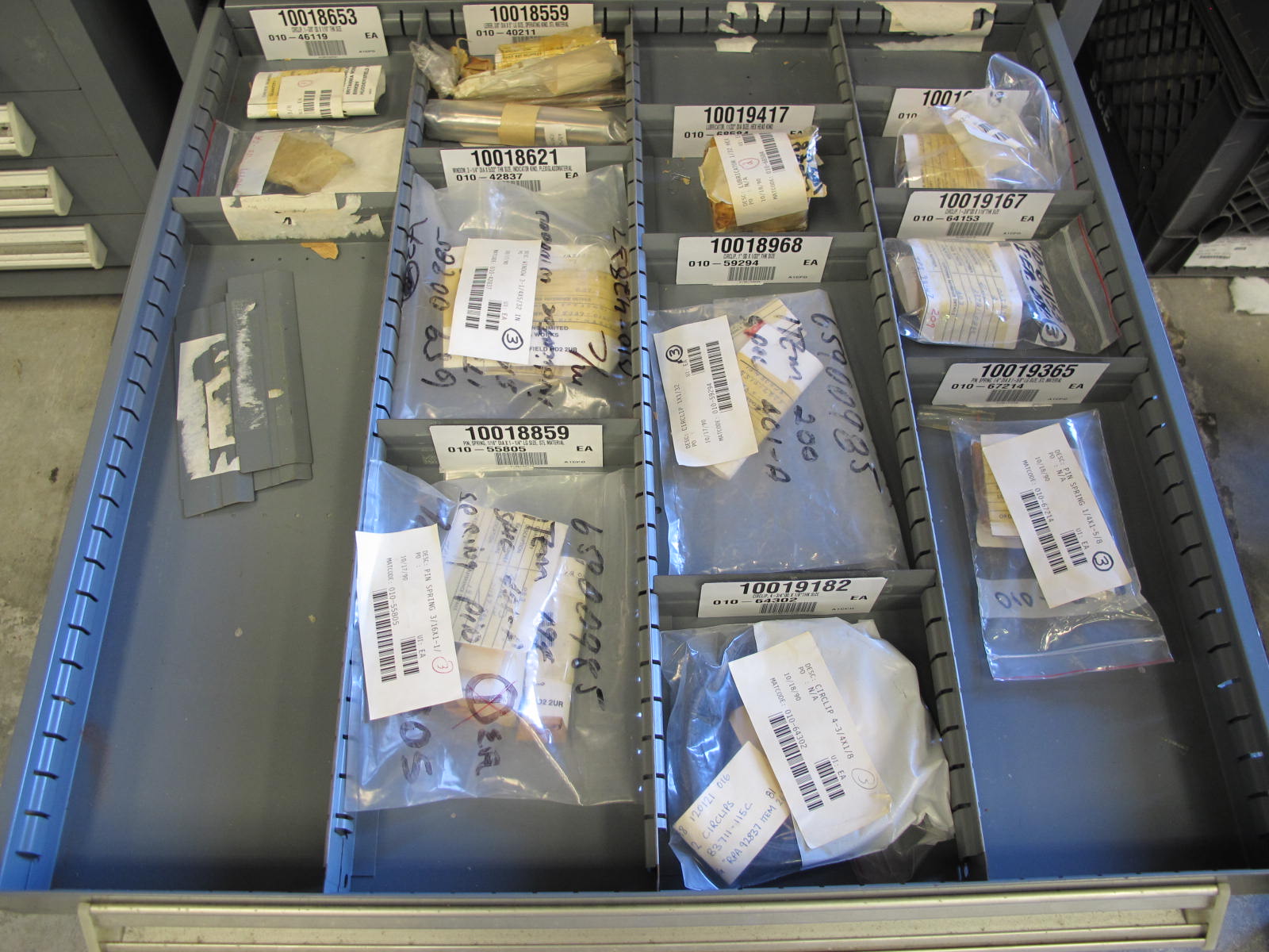 STANLEY VIDMAR CABINET, 11 DRAWER, TO INCLUDE: TUBE PLUGS, VALVES, SPRINGS, PINS, CIRCUIT BREAKERS, CAPACITORS. LOCATED AT W-44. LOADING AND HANDLING FEE $25-370