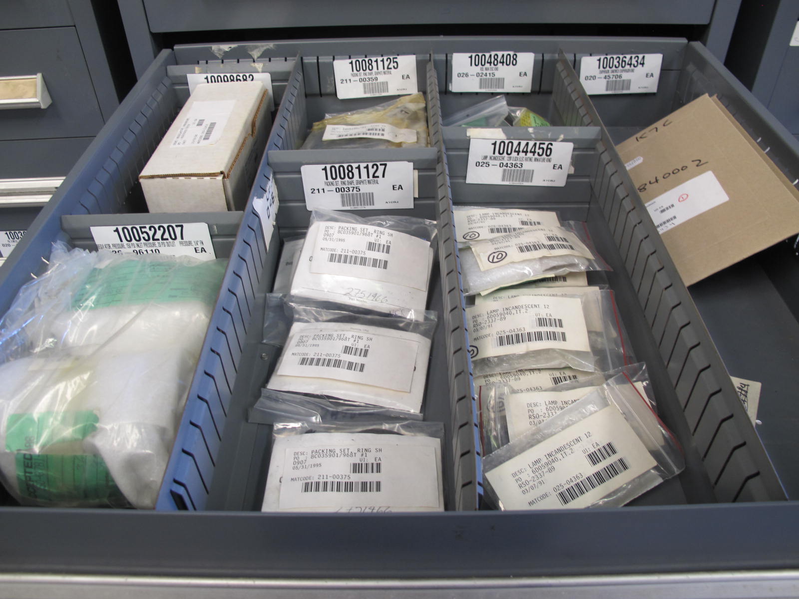 STANLEY VIDMAR CABINET, 11 DRAWER, TO INCLUDE: GASKETS, PRESSURE REGULATORS, INCANDESCENT LIGHTS, COUPLING SLEEVES, PRINTEDC CIRCUIT BOARDS, AIR FILTERS, BUSHINGS. LOCATED AT W-44. LOADING AND HANDLING FEE $25-371