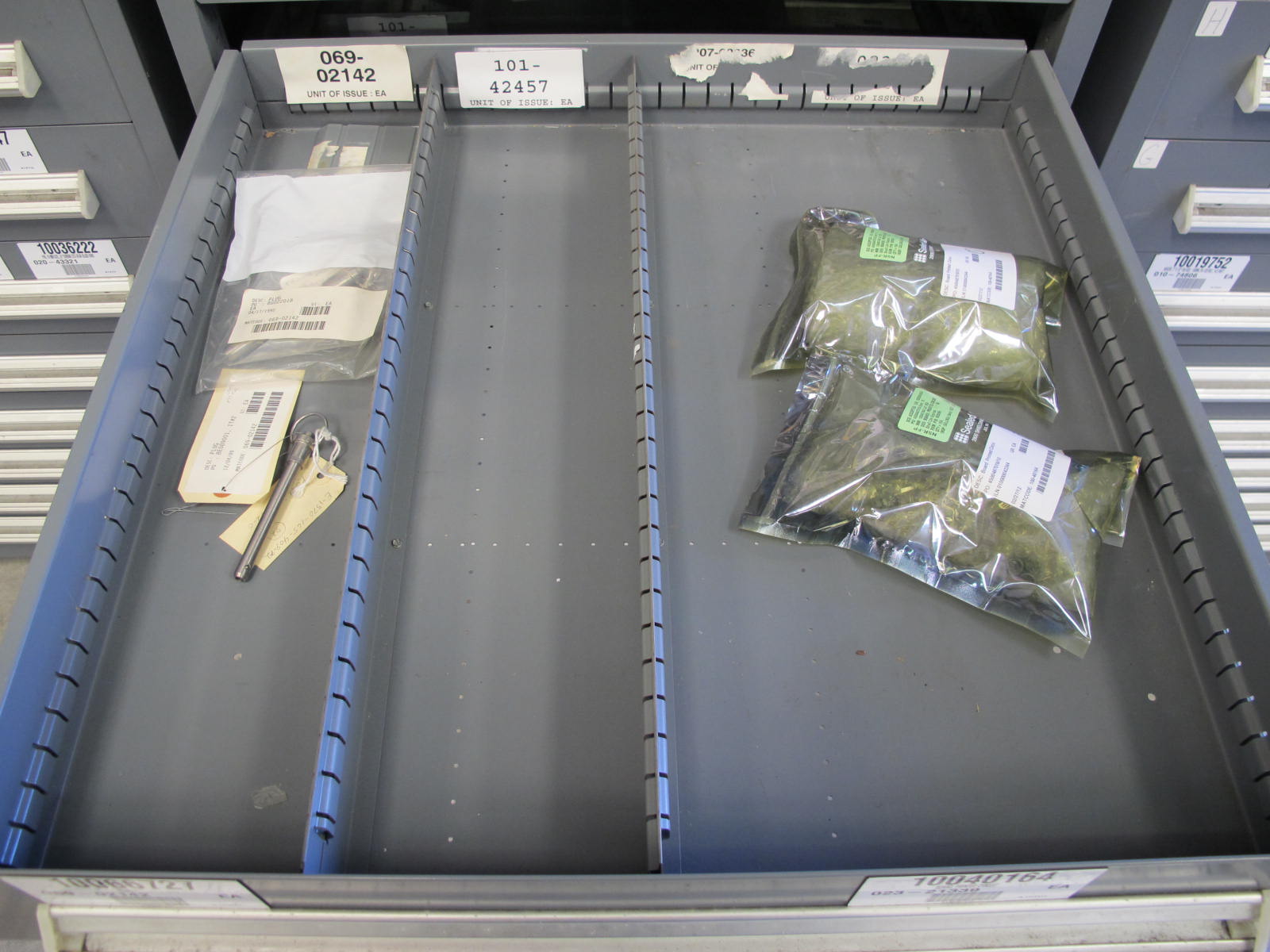 STANLEY VIDMAR CABINET, 11 DRAWER, TO INCLUDE: GASKETS, PRESSURE REGULATORS, INCANDESCENT LIGHTS, COUPLING SLEEVES, PRINTEDC CIRCUIT BOARDS, AIR FILTERS, BUSHINGS. LOCATED AT W-44. LOADING AND HANDLING FEE $25-371