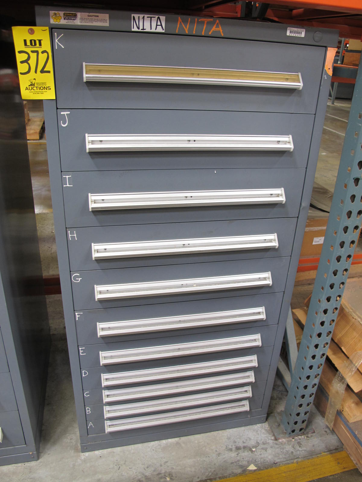 STANLEY VIDMAR CABINET, 11 DRAWER, TO INCLUDE: LIGHT BULBS, CHECK VALVES, PNUEMATIC TIME DELAY ATTACHMENTS, DEFLECTORS, CAMERA LENS, RECTIFIER, MISC MODULES, PRESSURE GAUGE, COMPRESSOR PISTONS. LOCATED AT W-50 . LOADING AND HANDLING FEE $25-372