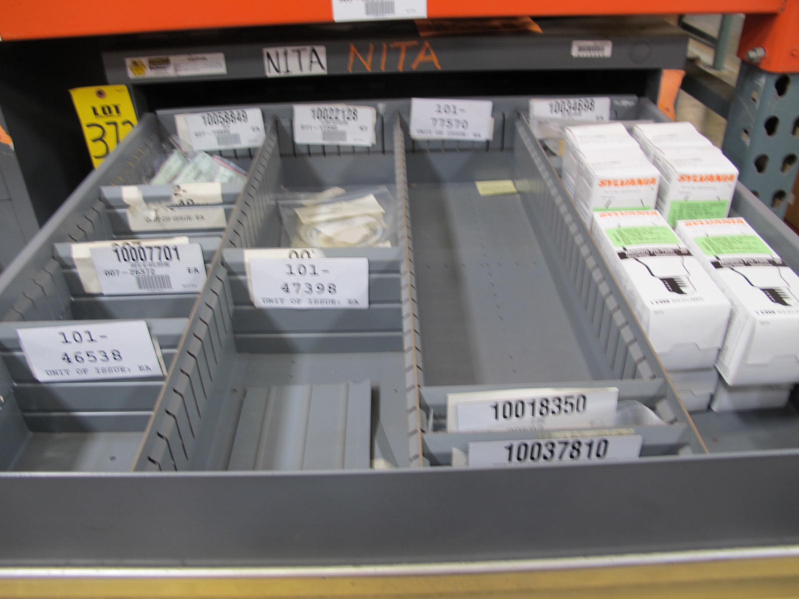 STANLEY VIDMAR CABINET, 11 DRAWER, TO INCLUDE: LIGHT BULBS, CHECK VALVES, PNUEMATIC TIME DELAY ATTACHMENTS, DEFLECTORS, CAMERA LENS, RECTIFIER, MISC MODULES, PRESSURE GAUGE, COMPRESSOR PISTONS. LOCATED AT W-50 . LOADING AND HANDLING FEE $25-372