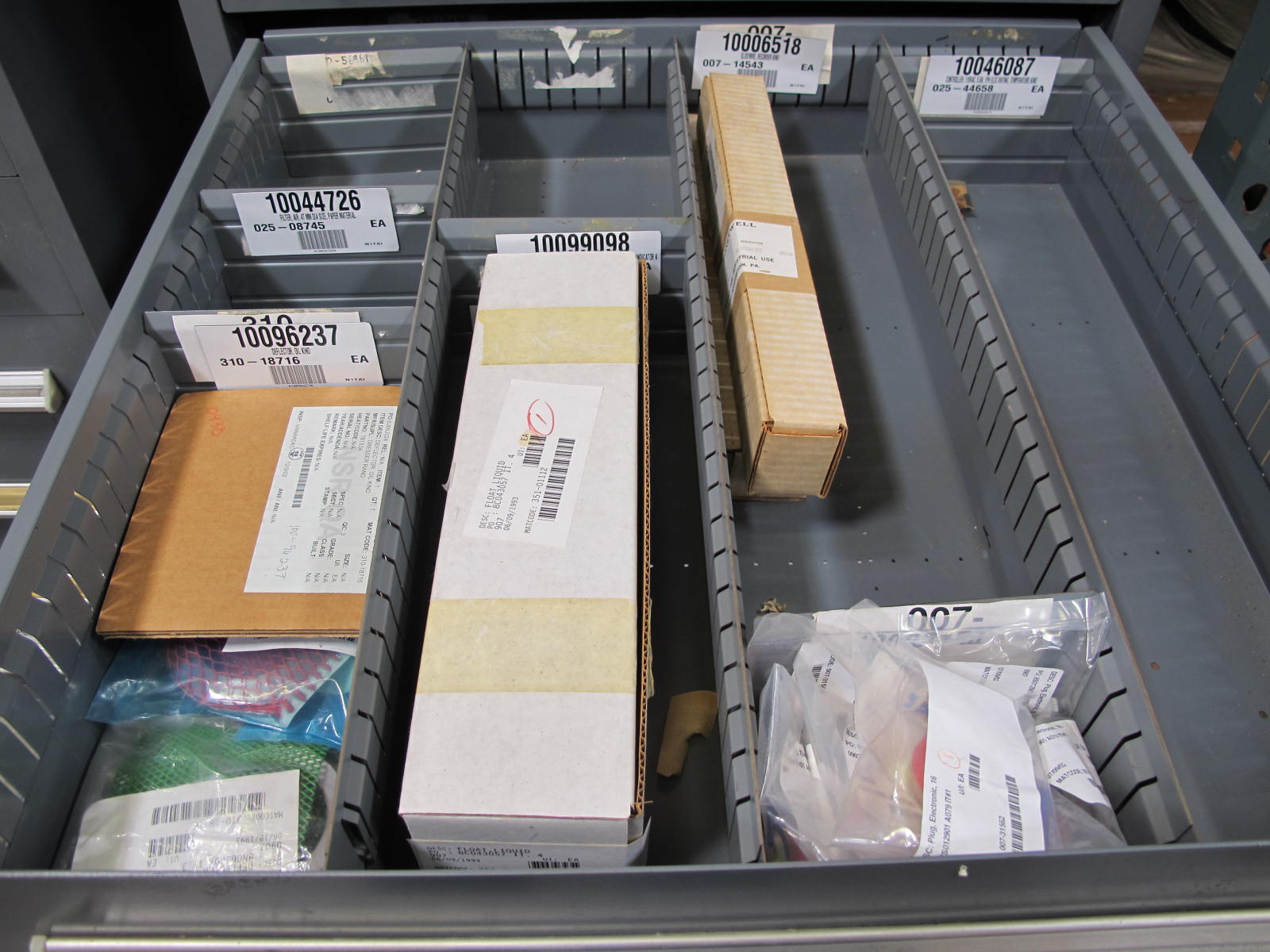 STANLEY VIDMAR CABINET, 11 DRAWER, TO INCLUDE: LIGHT BULBS, CHECK VALVES, PNUEMATIC TIME DELAY ATTACHMENTS, DEFLECTORS, CAMERA LENS, RECTIFIER, MISC MODULES, PRESSURE GAUGE, COMPRESSOR PISTONS. LOCATED AT W-50 . LOADING AND HANDLING FEE $25-372