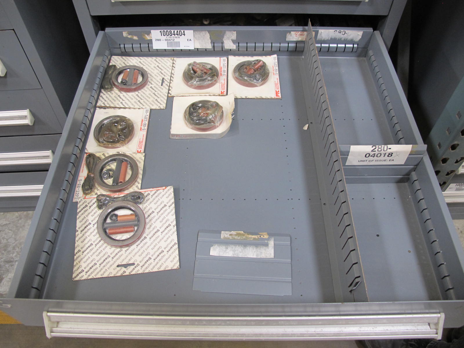 STANLEY VIDMAR CABINET, 11 DRAWER, TO INCLUDE: TERMINAL BLOCKS, PILOT LIGHTS, BELLOWS, SHAFTS, CAPS, PLUG VALVES, CIRCUITS . LOCATED AT W-50 . LOADING AND HANDLING FEE $25-375