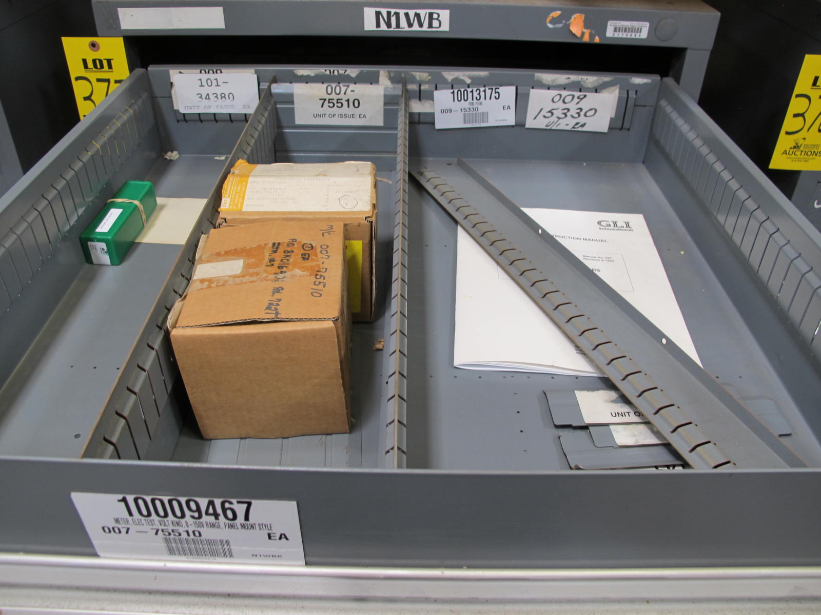 STANLEY VIDMAR CABINET, 11 DRAWER, TO INCLUDE: VOLT METERS, THERMOCOUPLE WIRE, BALLASTS, GROMMETS, ROLLERS, BLANK METERS, SUPPRESSORS. LOCATED AT W-50 . LOADING AND HANDLING FEE $25-377