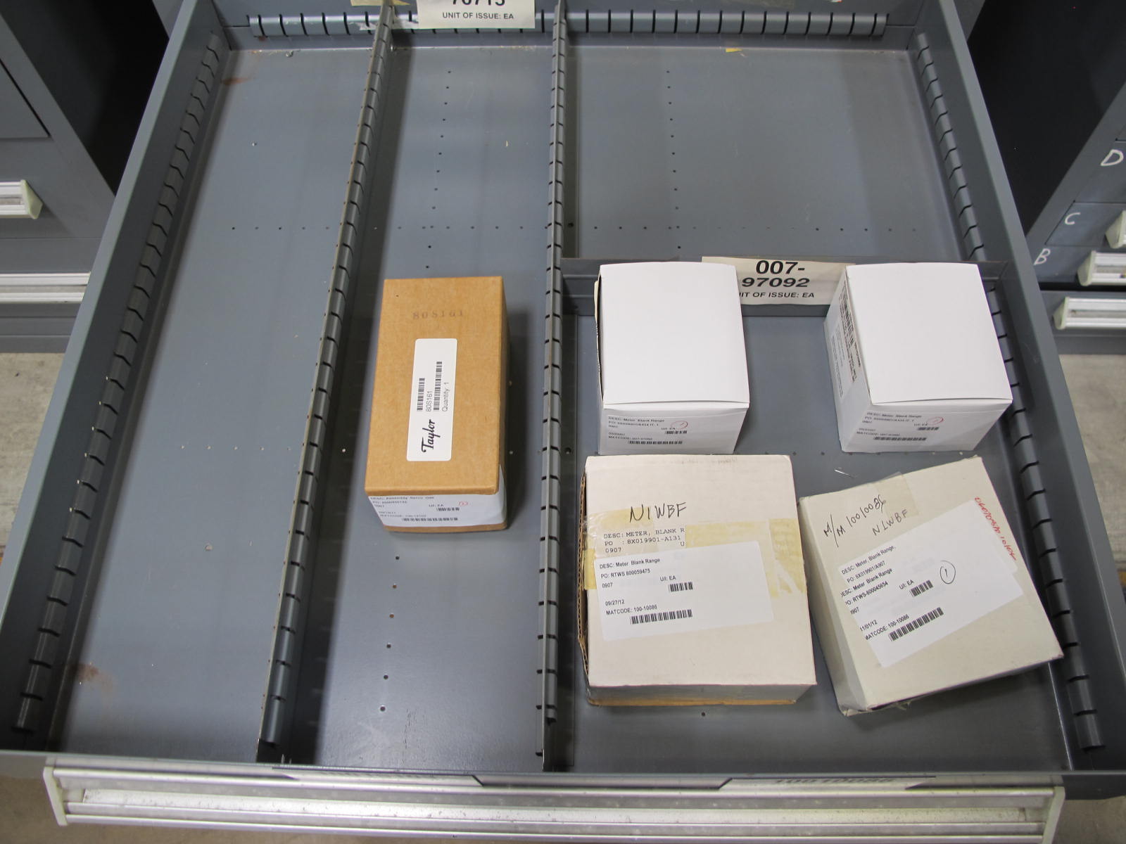 STANLEY VIDMAR CABINET, 11 DRAWER, TO INCLUDE: VOLT METERS, THERMOCOUPLE WIRE, BALLASTS, GROMMETS, ROLLERS, BLANK METERS, SUPPRESSORS. LOCATED AT W-50 . LOADING AND HANDLING FEE $25-377