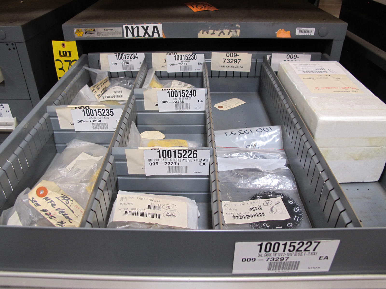 STANLEY VIDMAR CABINET, 11 DRAWER, TO INCLUDE: SPROCKETS, KNOBS, FLANGES, SYNCHROSCOPE, RESISTANCE DETECTORS, COMPRESSOR DETECTOR, SHEAVE, COVERS, POWER SUPPLIES, RESISTORS. LOCATED AT W-50 . LOADING AND HANDLING FEE $25-379