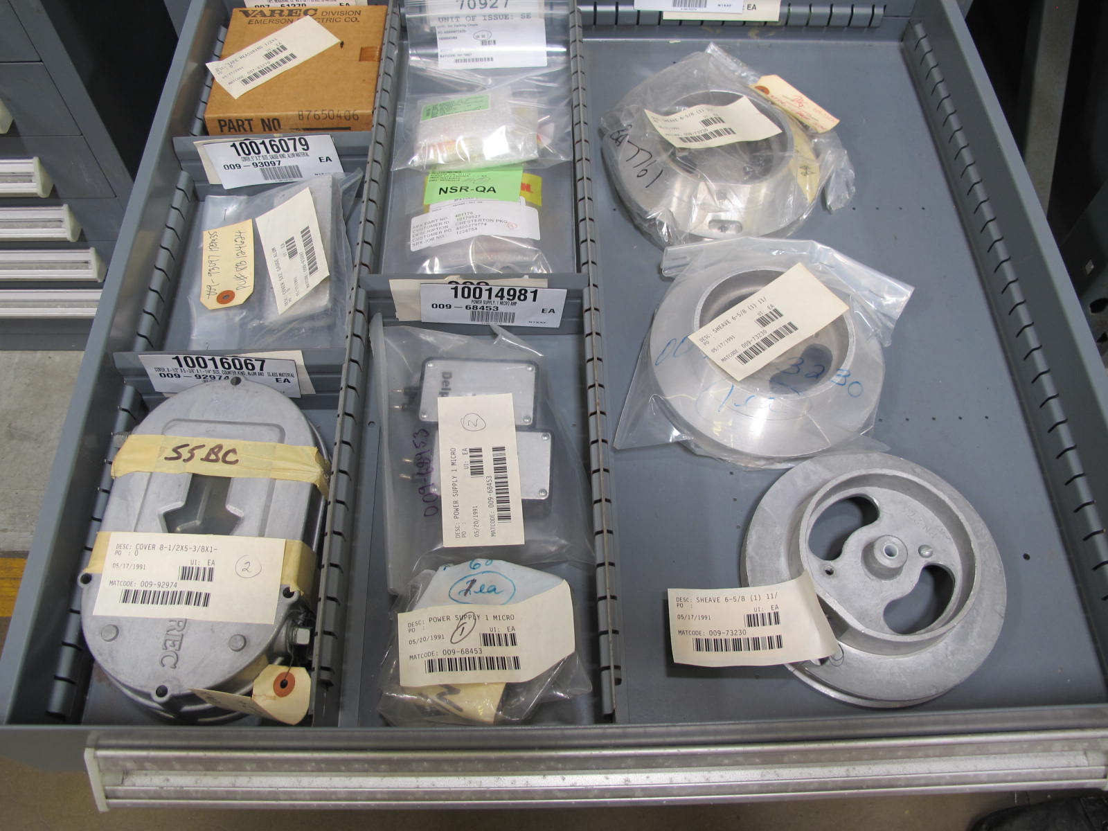STANLEY VIDMAR CABINET, 11 DRAWER, TO INCLUDE: SPROCKETS, KNOBS, FLANGES, SYNCHROSCOPE, RESISTANCE DETECTORS, COMPRESSOR DETECTOR, SHEAVE, COVERS, POWER SUPPLIES, RESISTORS. LOCATED AT W-50 . LOADING AND HANDLING FEE $25-379
