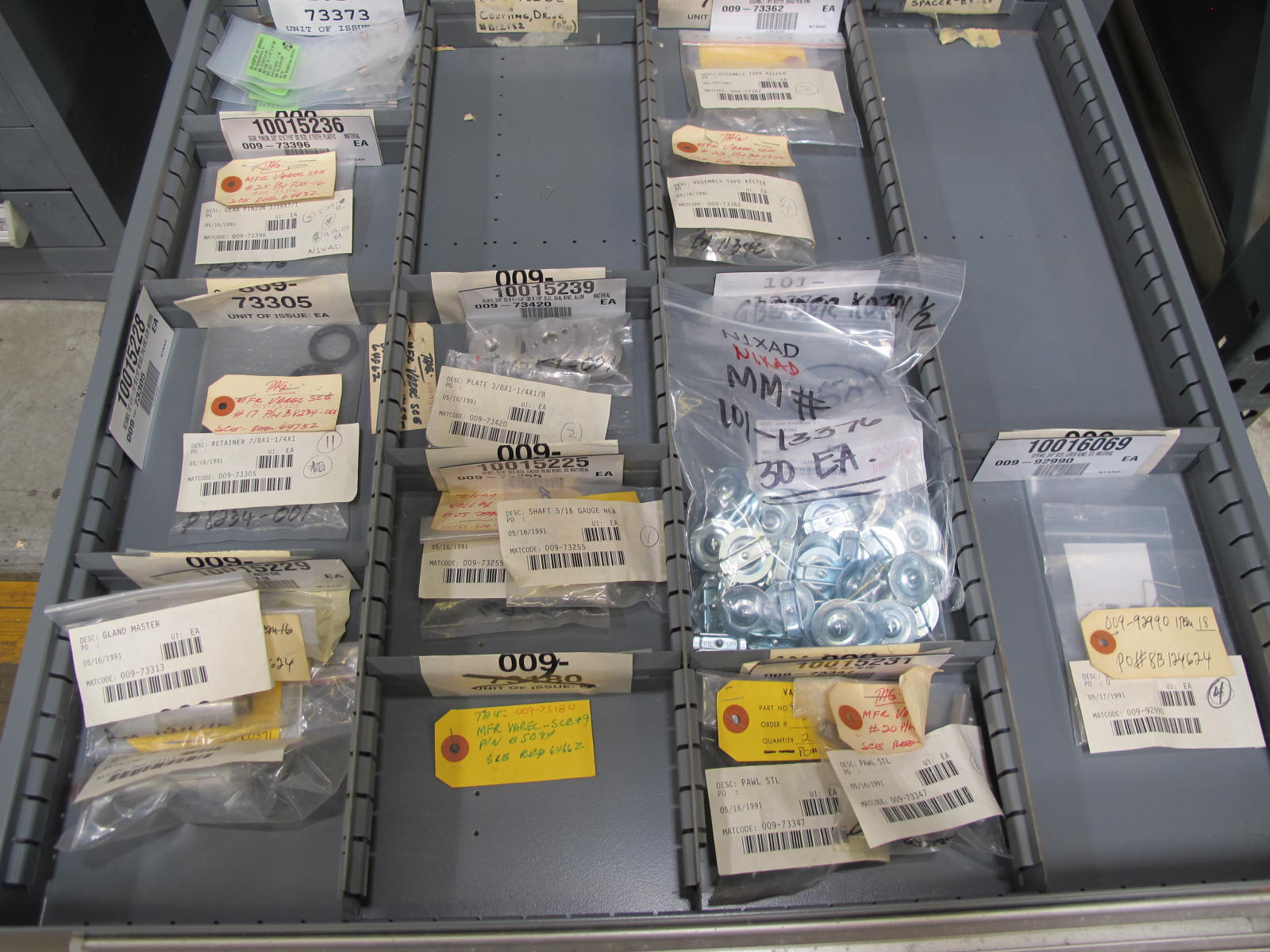 STANLEY VIDMAR CABINET, 11 DRAWER, TO INCLUDE: SPROCKETS, KNOBS, FLANGES, SYNCHROSCOPE, RESISTANCE DETECTORS, COMPRESSOR DETECTOR, SHEAVE, COVERS, POWER SUPPLIES, RESISTORS. LOCATED AT W-50 . LOADING AND HANDLING FEE $25-379