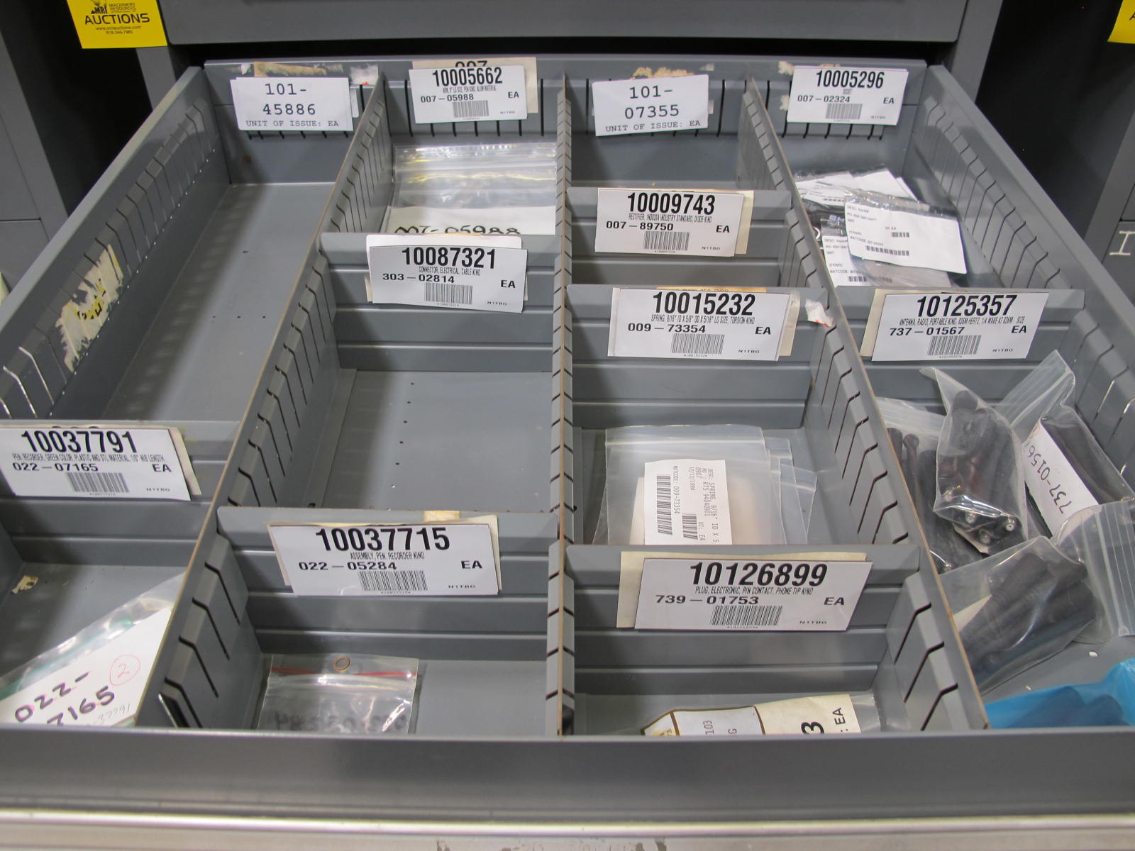 STANLEY VIDMAR CABINET, 8 DRAWER, TO INCLUDE: LIGHT BULBS, SWITCHES, PLUGS, RADIO ANTENNAS, CONTACT BLOCKS, CIRCUITS, SURGE PROTECTORS, SOCKETS, CORDS. LOCATED AT W-50 . LOADING AND HANDLING FEE $25-380