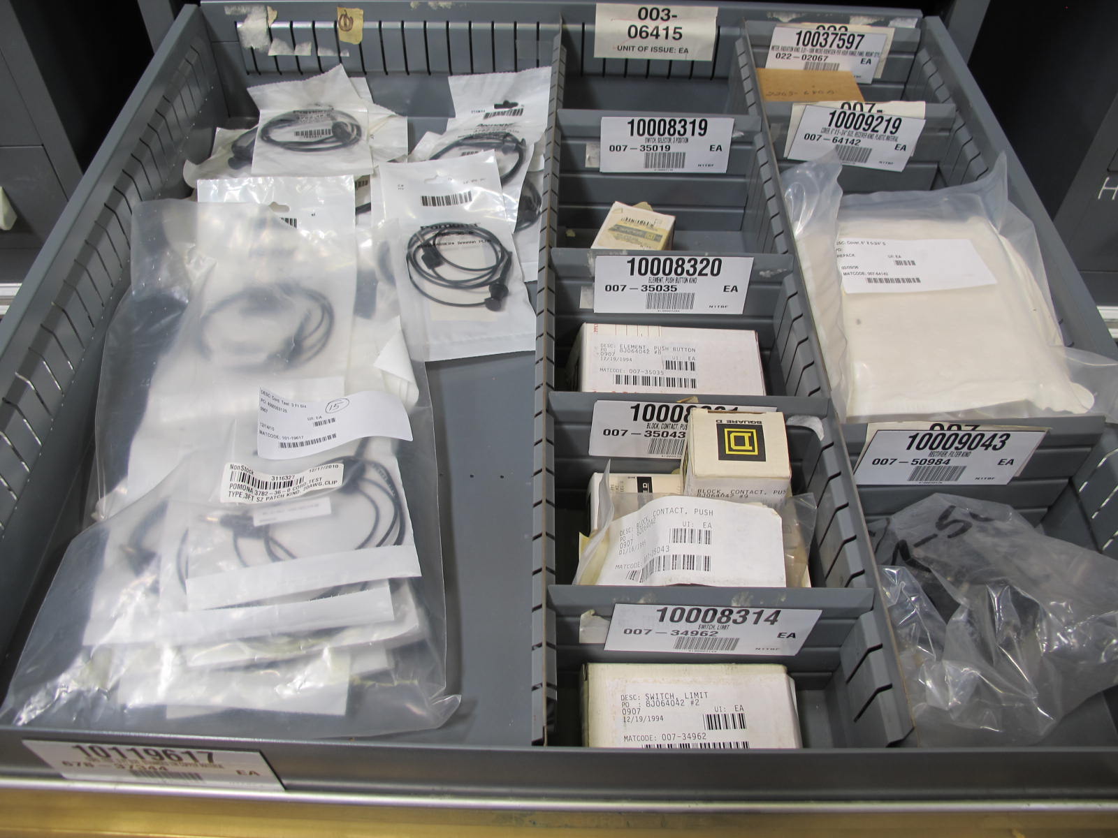 STANLEY VIDMAR CABINET, 8 DRAWER, TO INCLUDE: LIGHT BULBS, SWITCHES, PLUGS, RADIO ANTENNAS, CONTACT BLOCKS, CIRCUITS, SURGE PROTECTORS, SOCKETS, CORDS. LOCATED AT W-50 . LOADING AND HANDLING FEE $25-380