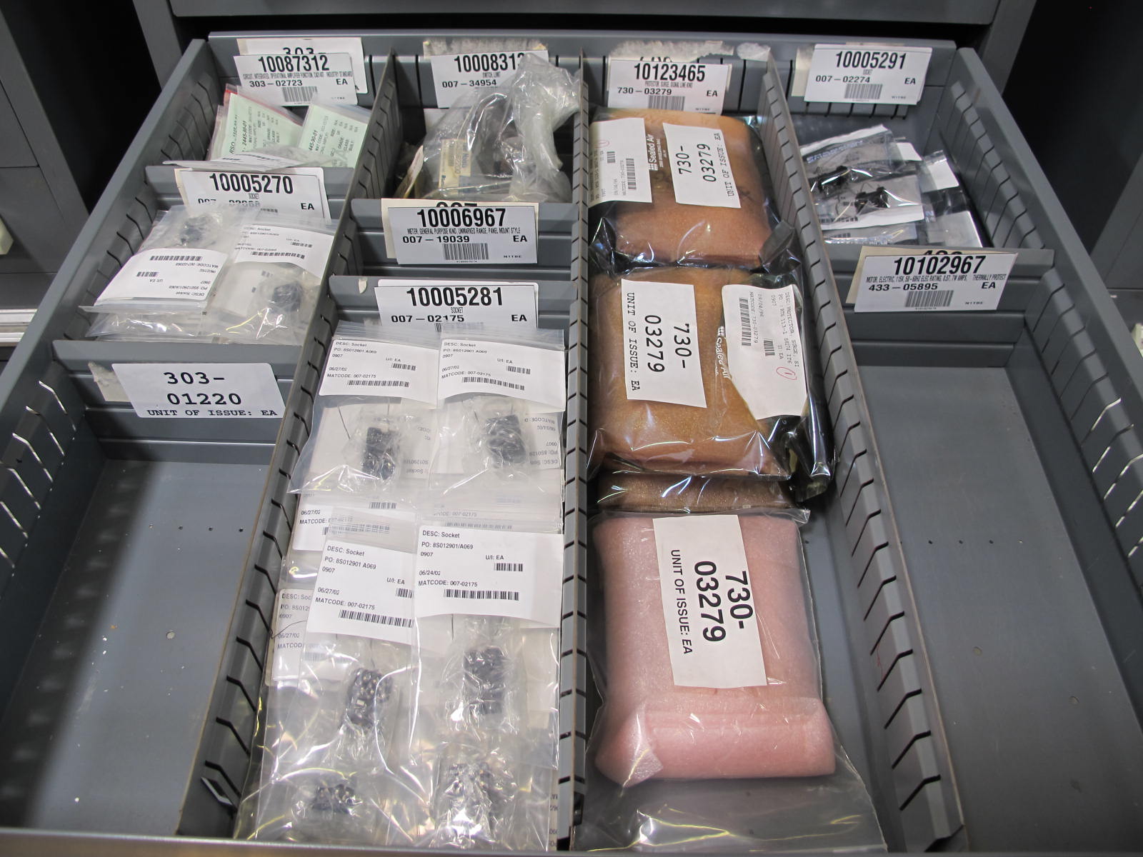 STANLEY VIDMAR CABINET, 8 DRAWER, TO INCLUDE: LIGHT BULBS, SWITCHES, PLUGS, RADIO ANTENNAS, CONTACT BLOCKS, CIRCUITS, SURGE PROTECTORS, SOCKETS, CORDS. LOCATED AT W-50 . LOADING AND HANDLING FEE $25-380