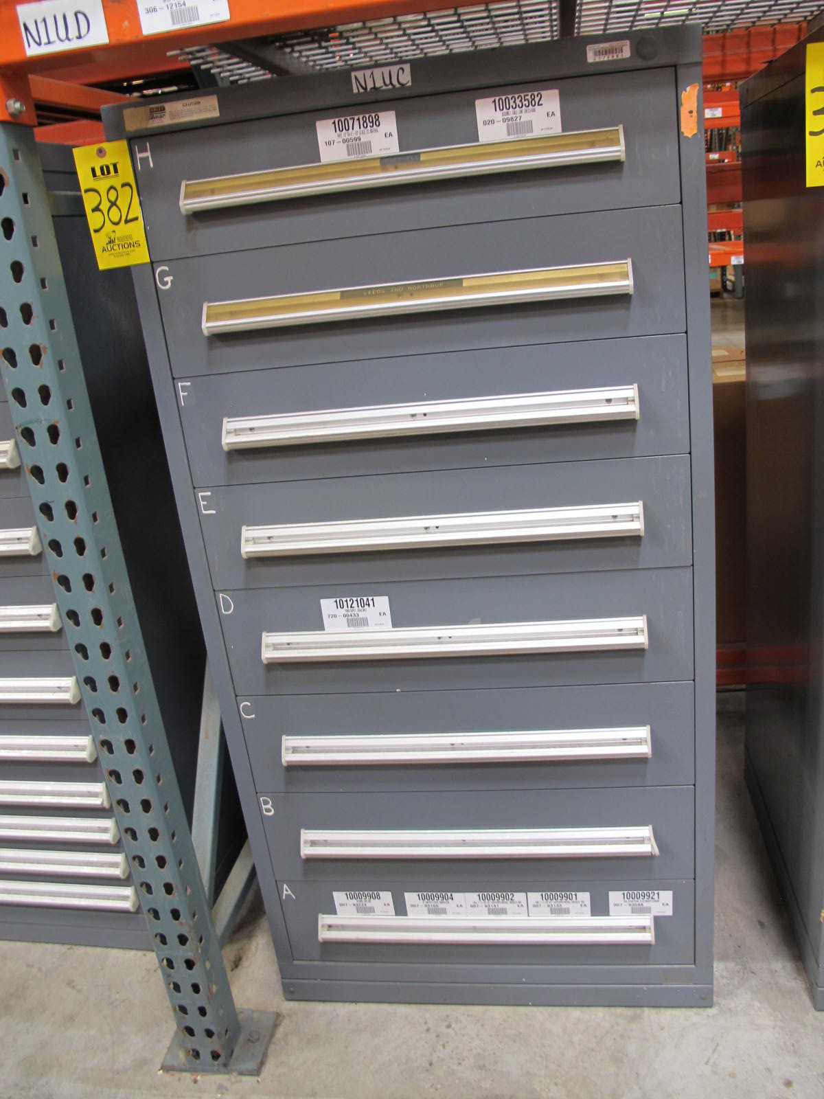 STANLEY VIDMAR CABINET, 8 DRAWER, TO INCLUDE: RIVETS, ELECTRICAL SOCKETS, CAPS, PHOTOELECTRIC CELLS, CAPACITORS, WORM AND SPUR GEARS, POWER SUPPLY, OILERS. LOCATED AT W-50 . LOADING AND HANDLING FEE $25-382