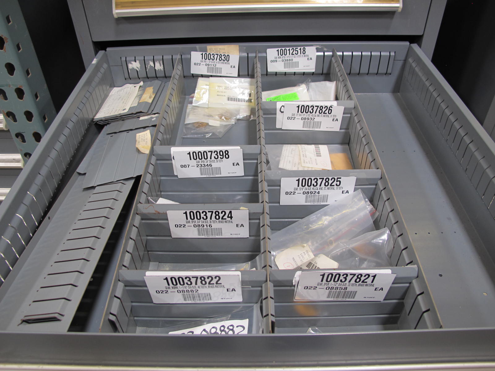 STANLEY VIDMAR CABINET, 8 DRAWER, TO INCLUDE: RIVETS, ELECTRICAL SOCKETS, CAPS, PHOTOELECTRIC CELLS, CAPACITORS, WORM AND SPUR GEARS, POWER SUPPLY, OILERS. LOCATED AT W-50 . LOADING AND HANDLING FEE $25-382