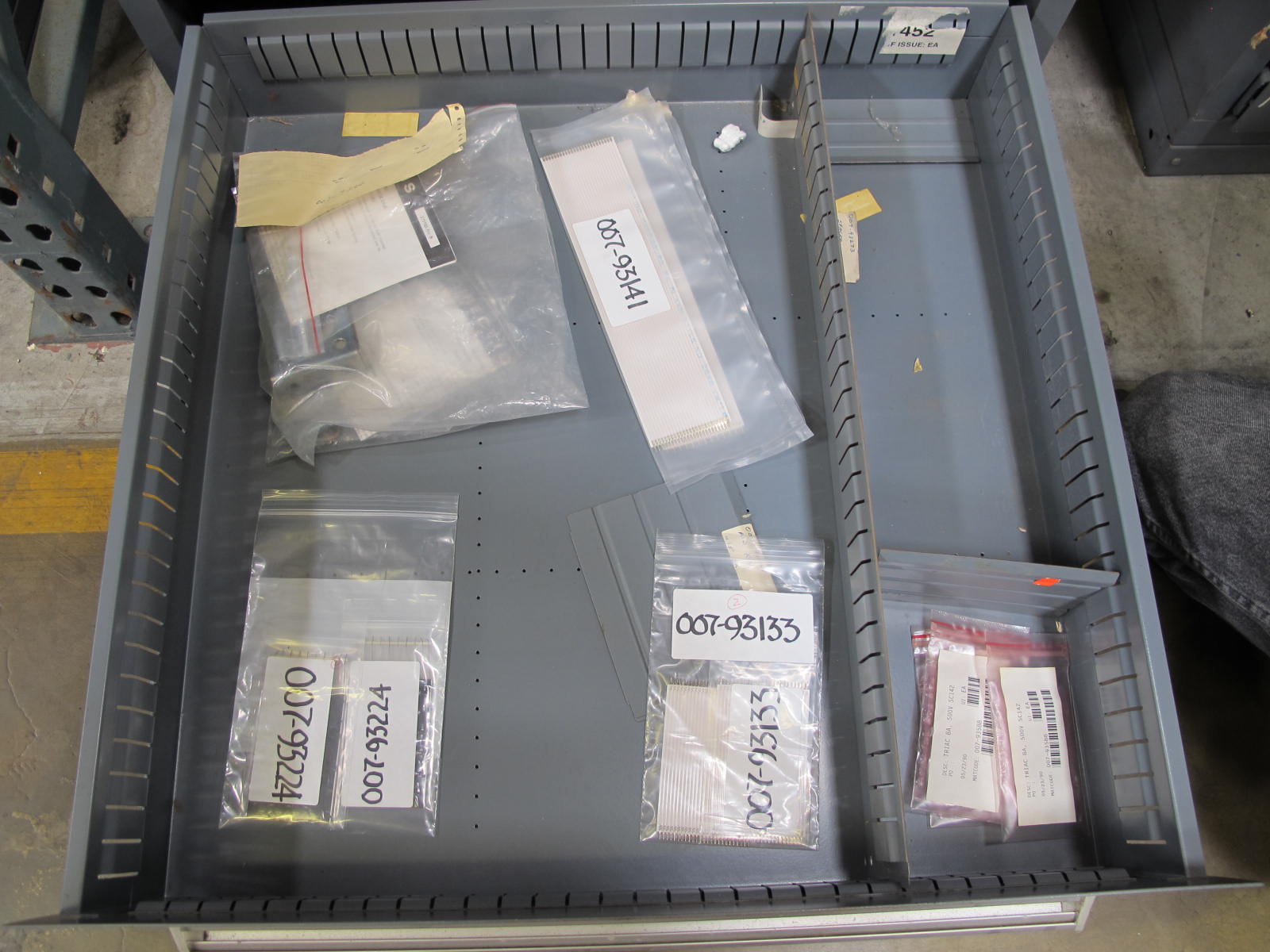 STANLEY VIDMAR CABINET, 8 DRAWER, TO INCLUDE: RIVETS, ELECTRICAL SOCKETS, CAPS, PHOTOELECTRIC CELLS, CAPACITORS, WORM AND SPUR GEARS, POWER SUPPLY, OILERS. LOCATED AT W-50 . LOADING AND HANDLING FEE $25-382