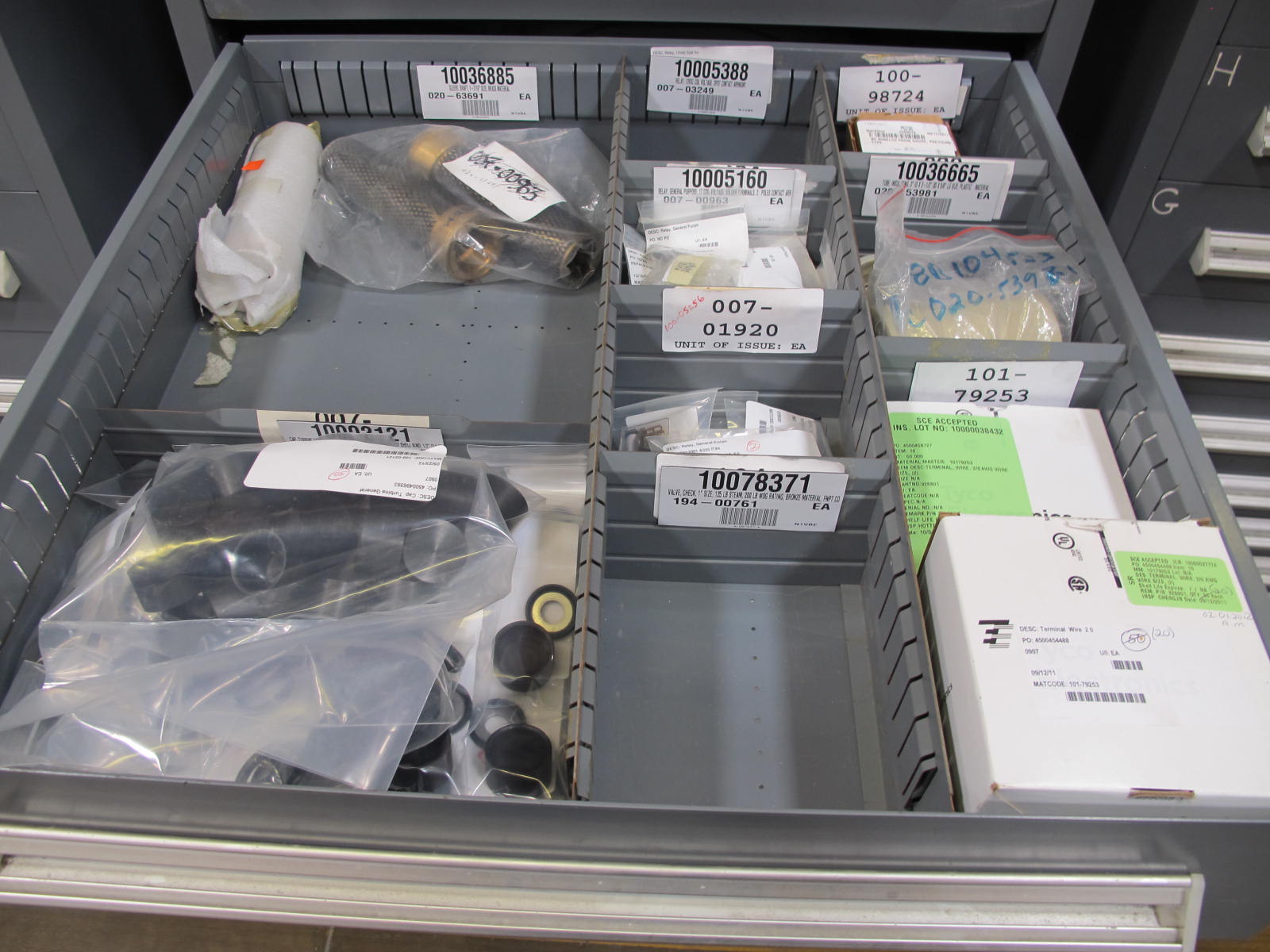 STANLEY VIDMAR CABINET, 8 DRAWER, TO INCLUDE: SCREEN FILTERS, METERING TUBES, TERMINAL WIRES, RELAYS, PRESSURE GAUGE, BRASS SHAFTS, ROTAMETERS, PINS, RINGS. LOCATED AT W-50 . LOADING AND HANDLING FEE $25-383