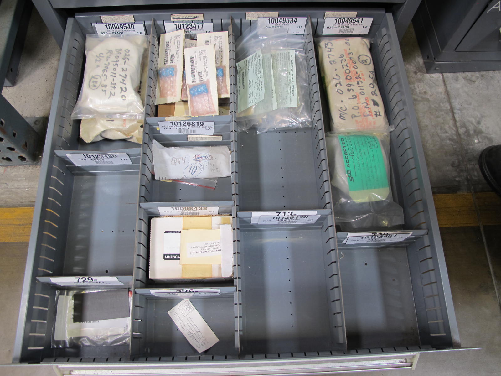 STANLEY VIDMAR CABINET, 8 DRAWER, TO INCLUDE: THERMOMETER, PHONE CORDS, RELAYS, HYGROMETERS, TERMINAL WIRES, FILTERS, MISC BRASS PARTS, SCREW KIT FOR ROSEMOUNT TRANSMITTERS. LOCATED AT W-50 . LOADING AND HANDLING FEE $25-384