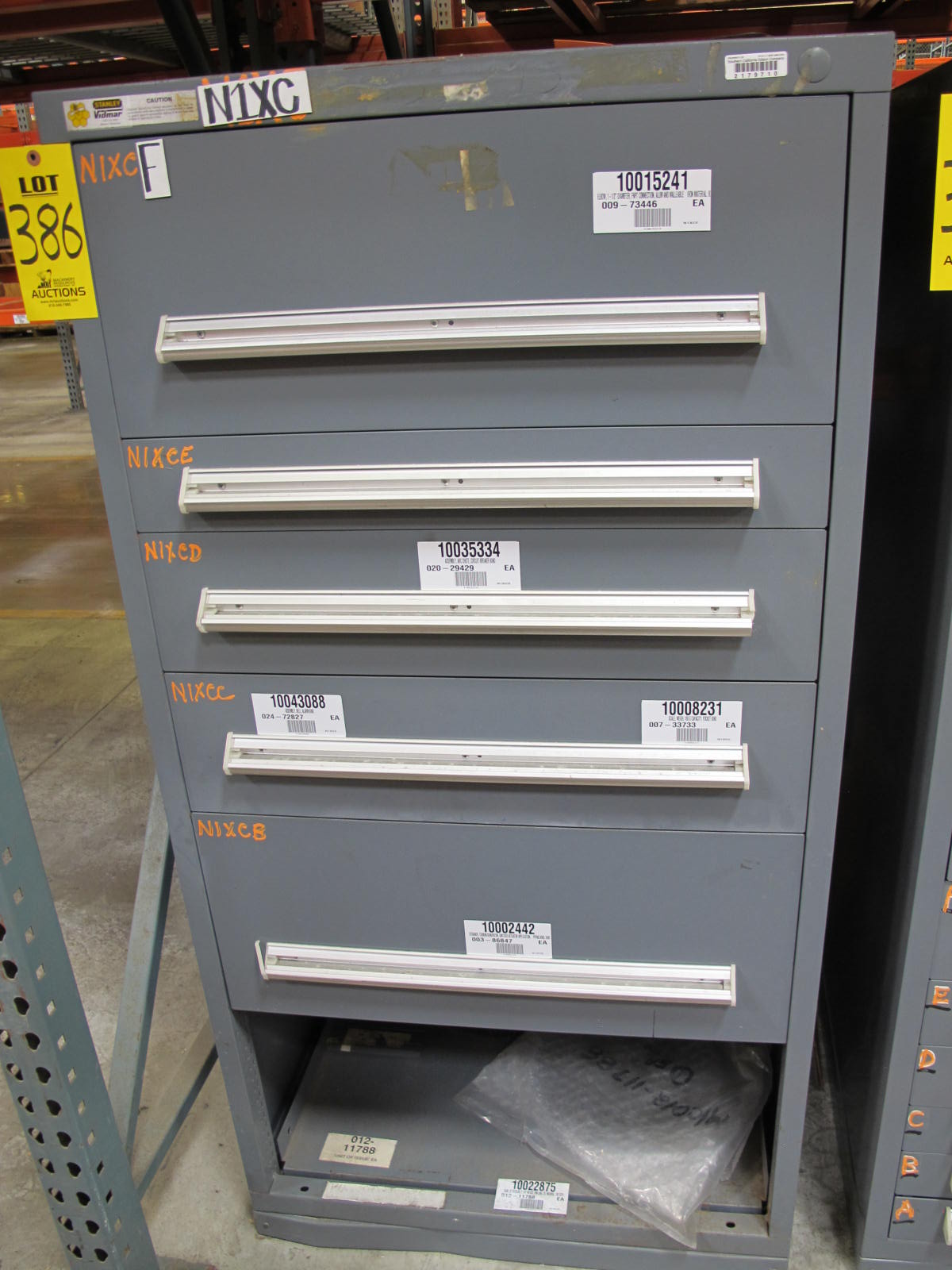 STANLEY VIDMAR CABINET, 5 DRAWER, TO INCLUDE: ELBOWS, ANCHORS, PINION GEARS, ARC CHUTES, ELECTRONIC BALANCES, STRAINERS. LOCATED AT W-50 . LOADING AND HANDLING FEE $25-386