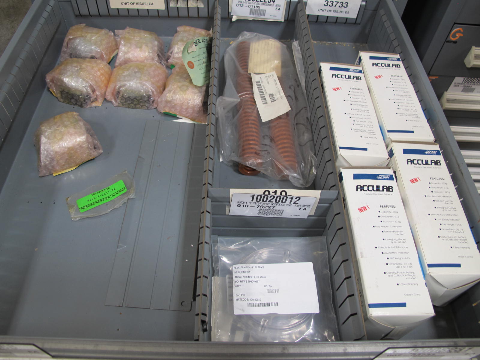 STANLEY VIDMAR CABINET, 5 DRAWER, TO INCLUDE: ELBOWS, ANCHORS, PINION GEARS, ARC CHUTES, ELECTRONIC BALANCES, STRAINERS. LOCATED AT W-50 . LOADING AND HANDLING FEE $25-386