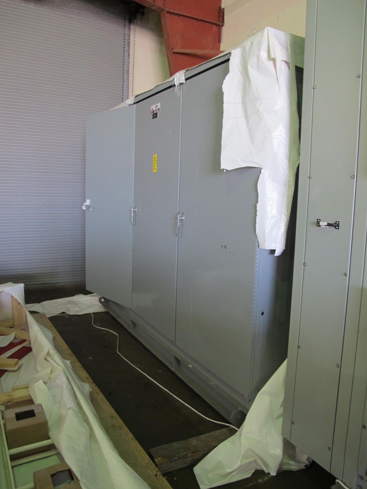 INDUSTRIAL ELECTRIC MANUFACTURING, MOTOR CONTROL CENTER, VOLTS 480, 60 HZ, THREE PHASE, SECTION AMPS 2000, SUPPLY AMPS 4000, R.M.S SYMMETRICAL AMPS 65000, 3 COLUMN WITH (8) SIEMENS VACU-BRAKE SWITCH BREAKERS. 600 AMP, 600 VOLT MAX, THREE POLE, THREE PHASE, (1) SIEMENS VACU-BRAKE SWITCH BREAKER, 400 AMP, 400 MAX VOLTS, THREE POLE, THREE PHASE. LOCATED AT W-50 . LOADING AND HANDLING FEE $200-387