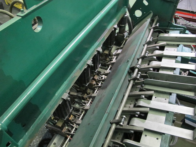 1999 CLIFFORD AUTOMATIC CNC MESH WELDING LINE, MODEL CLW12, 8MM-3MM LINE WIRE DIAMETER, 20 WIRE LINES, CROSSWIRE DIAMETER: 6MM, CROSSWIRE LENGTH: 1300 MM, LINEWIRE PITCH: INFINITELY VARIABLE FROM 10MM, CROSSWIRE FEED: SINGLE GAP TYPE MAGAZINE TOOLED FOR PRODUCING 2 MATS, SIDE BY SIDE, (10) WELDPRESSES, (20) BOTTOM ELECTRODES, (4) 125 KVA WELDING TRANSFORMERS, 120 CROSSWIRES MAX. SPEED, LINEAR MODEL QM12/25 PAILOUT, AUTOMATIC SHEET STACKER, WATER COOLING SYSTEM, MITSUISHI A1 CNC CONTROL, S/N 8874, SHEET STACKER, S/N 8979, (2) ENCLOSED CARTS FULL OF WELDING TIPS AND REALTED TOOLING INCLUDED WITH MACHINE-2