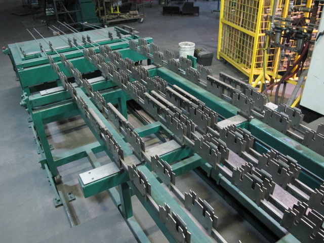 1999 CLIFFORD AUTOMATIC CNC MESH WELDING LINE, MODEL CLW12, 8MM-3MM LINE WIRE DIAMETER, 20 WIRE LINES, CROSSWIRE DIAMETER: 6MM, CROSSWIRE LENGTH: 1300 MM, LINEWIRE PITCH: INFINITELY VARIABLE FROM 10MM, CROSSWIRE FEED: SINGLE GAP TYPE MAGAZINE TOOLED FOR PRODUCING 2 MATS, SIDE BY SIDE, (10) WELDPRESSES, (20) BOTTOM ELECTRODES, (4) 125 KVA WELDING TRANSFORMERS, 120 CROSSWIRES MAX. SPEED, LINEAR MODEL QM12/25 PAILOUT, AUTOMATIC SHEET STACKER, WATER COOLING SYSTEM, MITSUISHI A1 CNC CONTROL, S/N 8874, SHEET STACKER, S/N 8979, (2) ENCLOSED CARTS FULL OF WELDING TIPS AND REALTED TOOLING INCLUDED WITH MACHINE-2