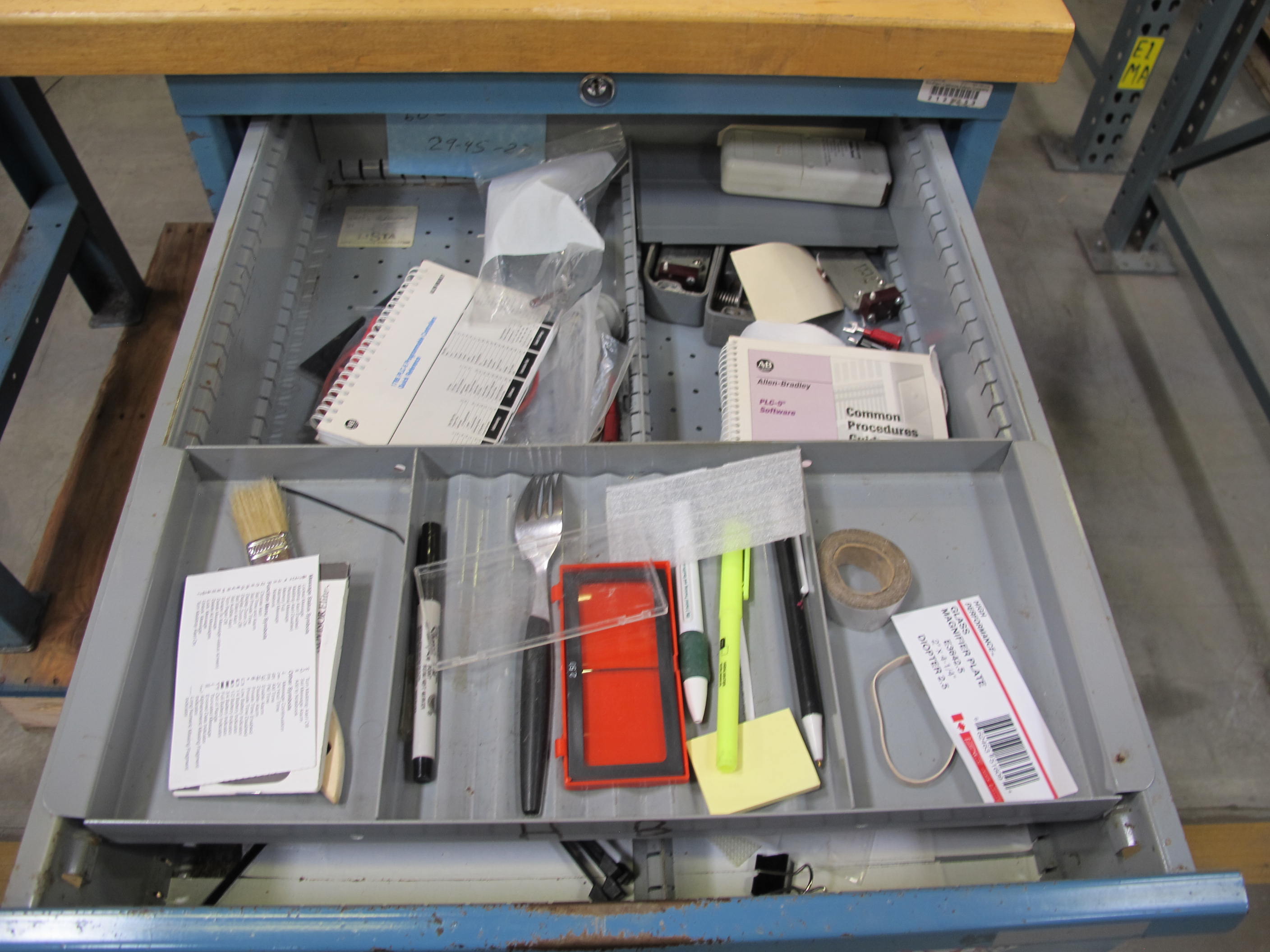 LISTA INDUSTRIAL WORK DESK, BUTCHER BLOCK TABLE TOP 48"L X 30"W, SHELF, 4 DRAWER CABINET WITH CONTENTS TO INCLUDE: MISC. OFFICE SUPPLIES, CABLES, AND EAR MUFFS. LOADING & HANDLING $15-1675