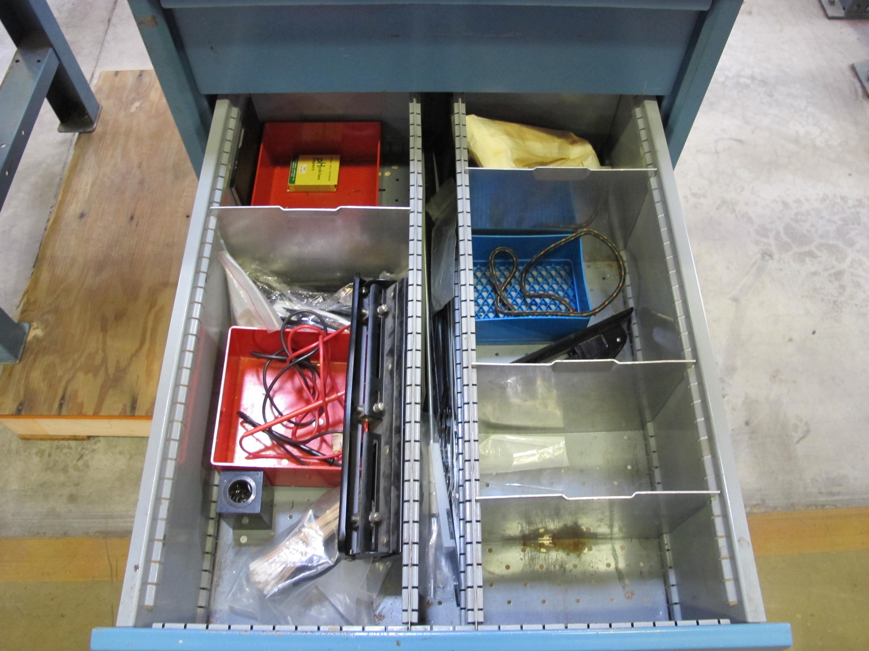 LISTA INDUSTRIAL WORK DESK, BUTCHER BLOCK TABLE TOP 48"L X 30"W, SHELF, 4 DRAWER CABINET WITH CONTENTS TO INCLUDE: MISC. OFFICE SUPPLIES, CABLES, SAFETY GLASSES, BRUSHES, ELECTRIC TESTING WIRE. LOADING & HANDLING $15-1691