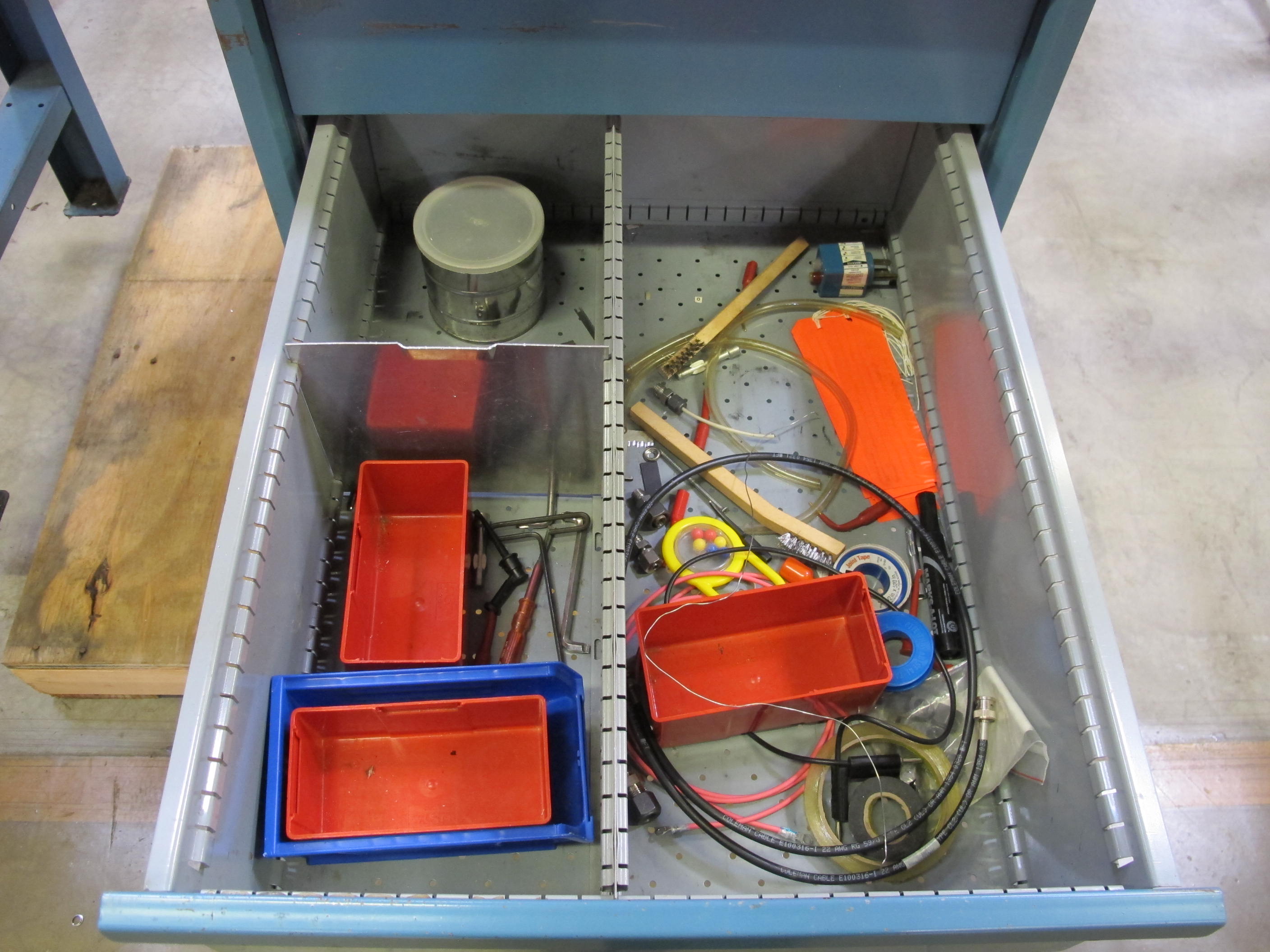 LISTA INDUSTRIAL WORK DESK, BUTCHER BLOCK TABLE TOP 48"L X 30"W, SHELF, 4 DRAWER CABINET WITH CONTENTS TO INCLUDE: MISC. OFFICE SUPPLIES, CABLES, SAFETY GLASSES, ELECTRIC TESTING WIRE. LOADING & HANDLING $15-1692